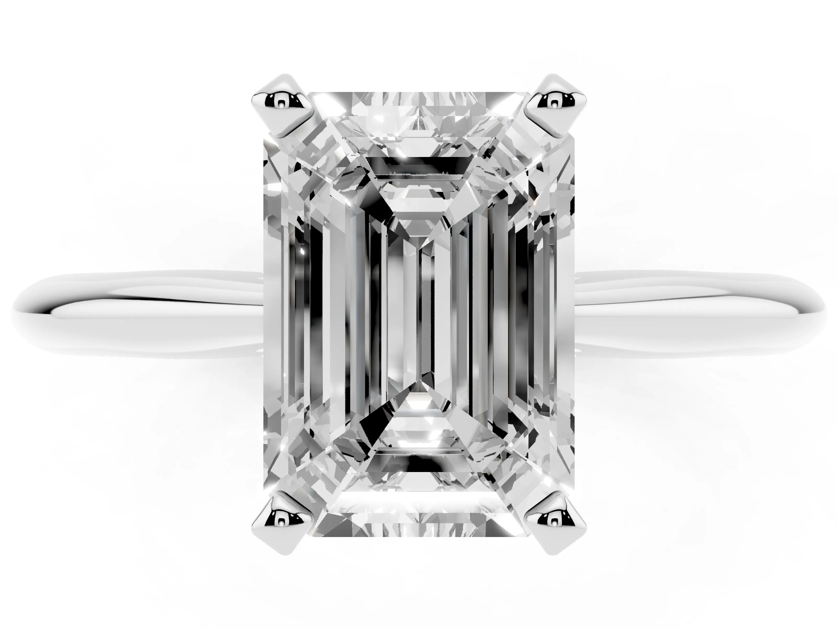 Emerald Cut Diamond Solitaire Ring Set in Silver with Prong Setting on a Plain Round Band