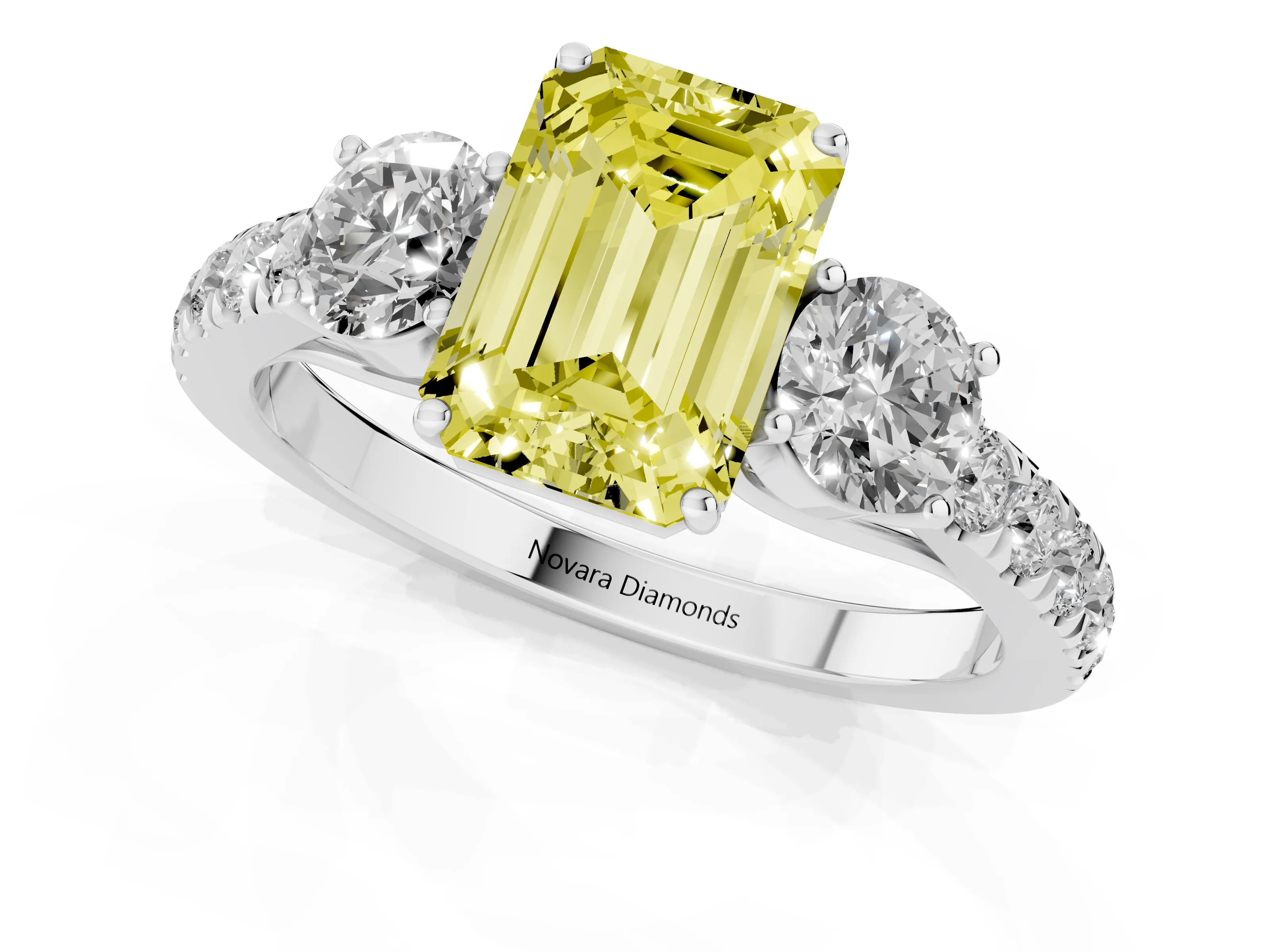 Fancy Yellow Emerald Cut Diamond Three-Stone Ring Set in White gold with Round Side Stones and Delicate Pavé Band