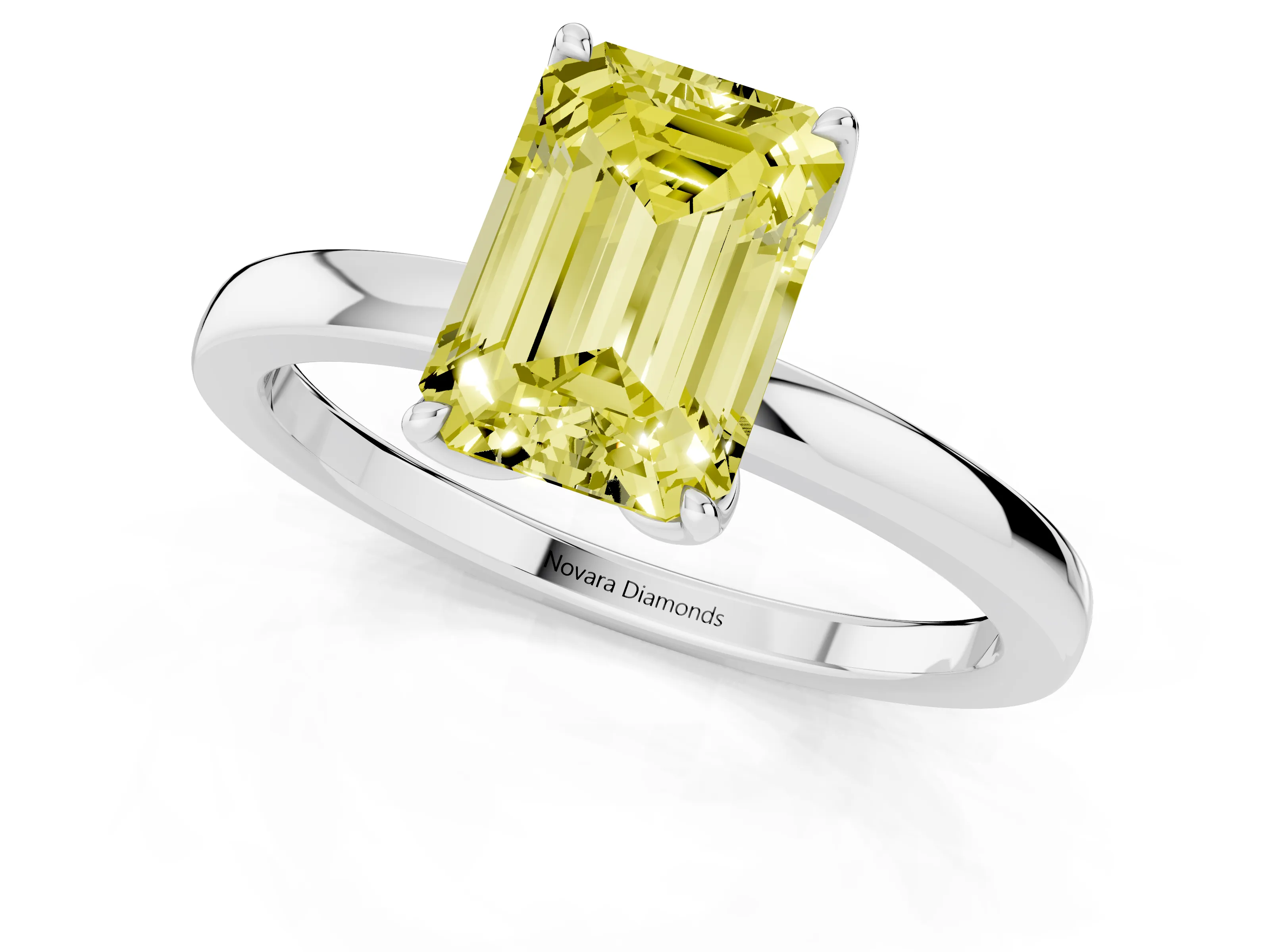Fancy Yellow Emerald Cut Diamond Solitaire Ring Set in White gold with Prong Setting and Thin Polished Band