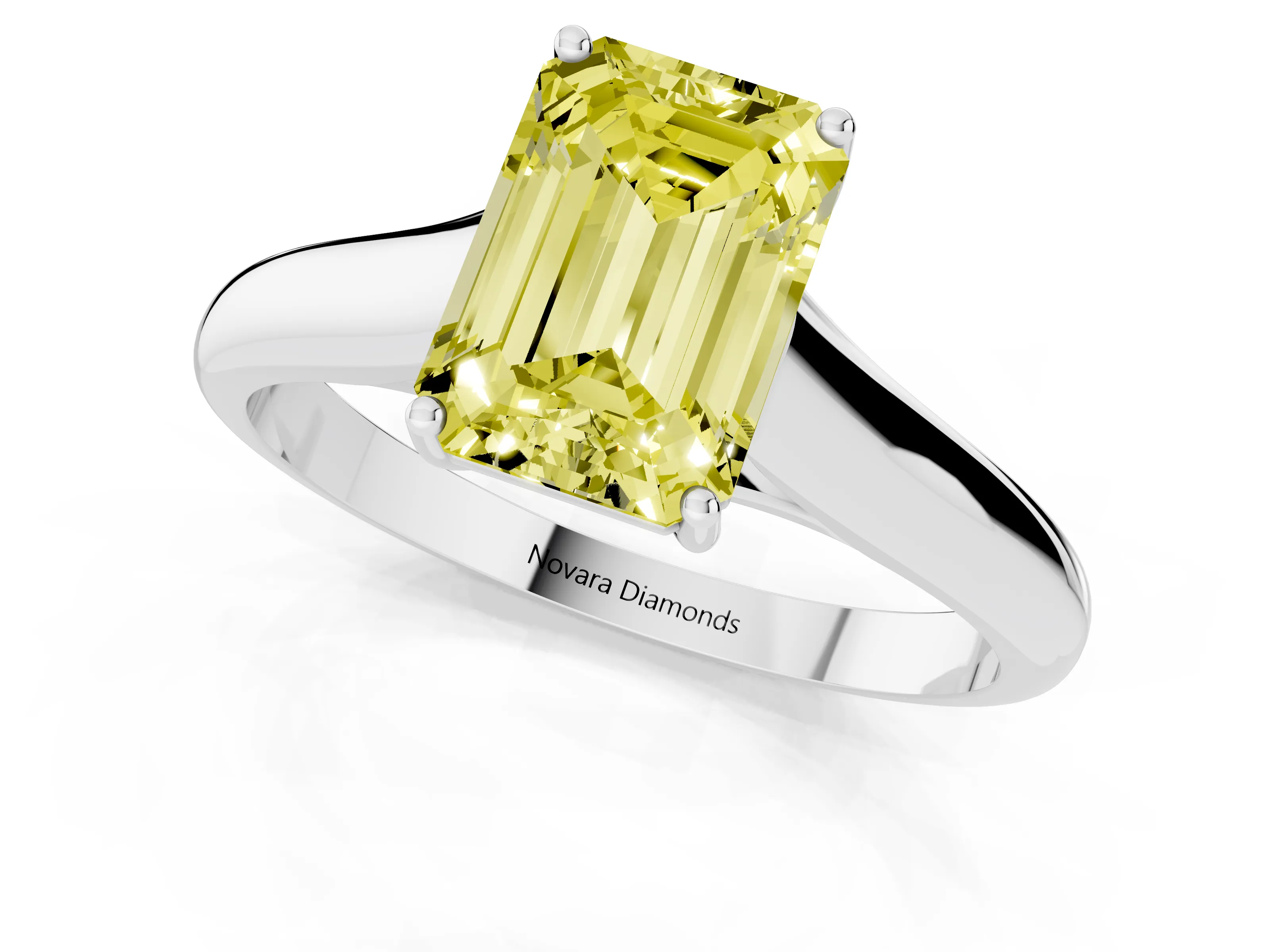 Fancy Yellow Emerald Cut Diamond Solitaire Engagement Ring Set in White gold with Subtly Tapered Band and Prong Setting
