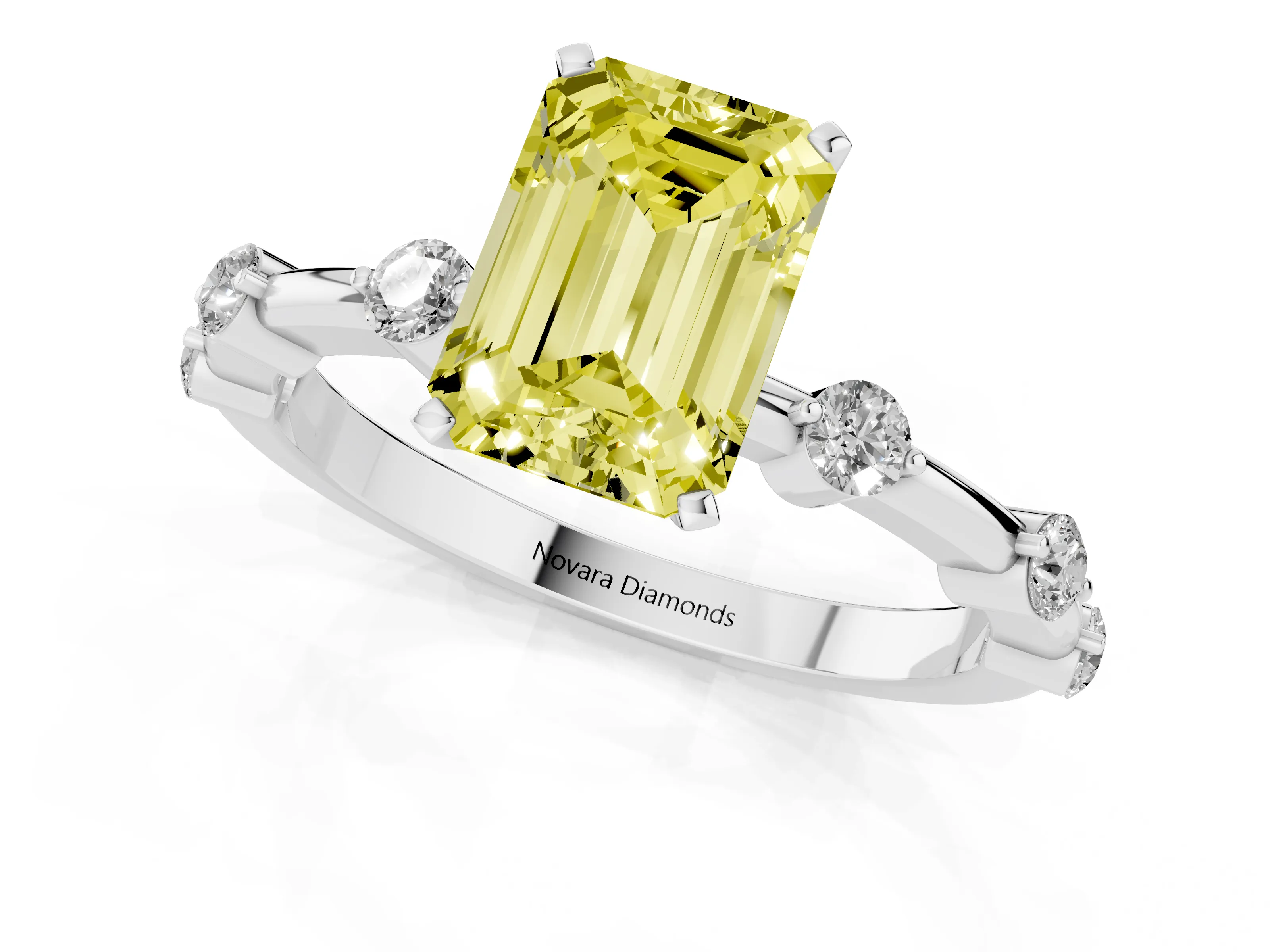 Fancy Yellow Emerald Cut Diamond Solitaire Ring Set in White gold with Bezel Set Side Stones and Prong Setting