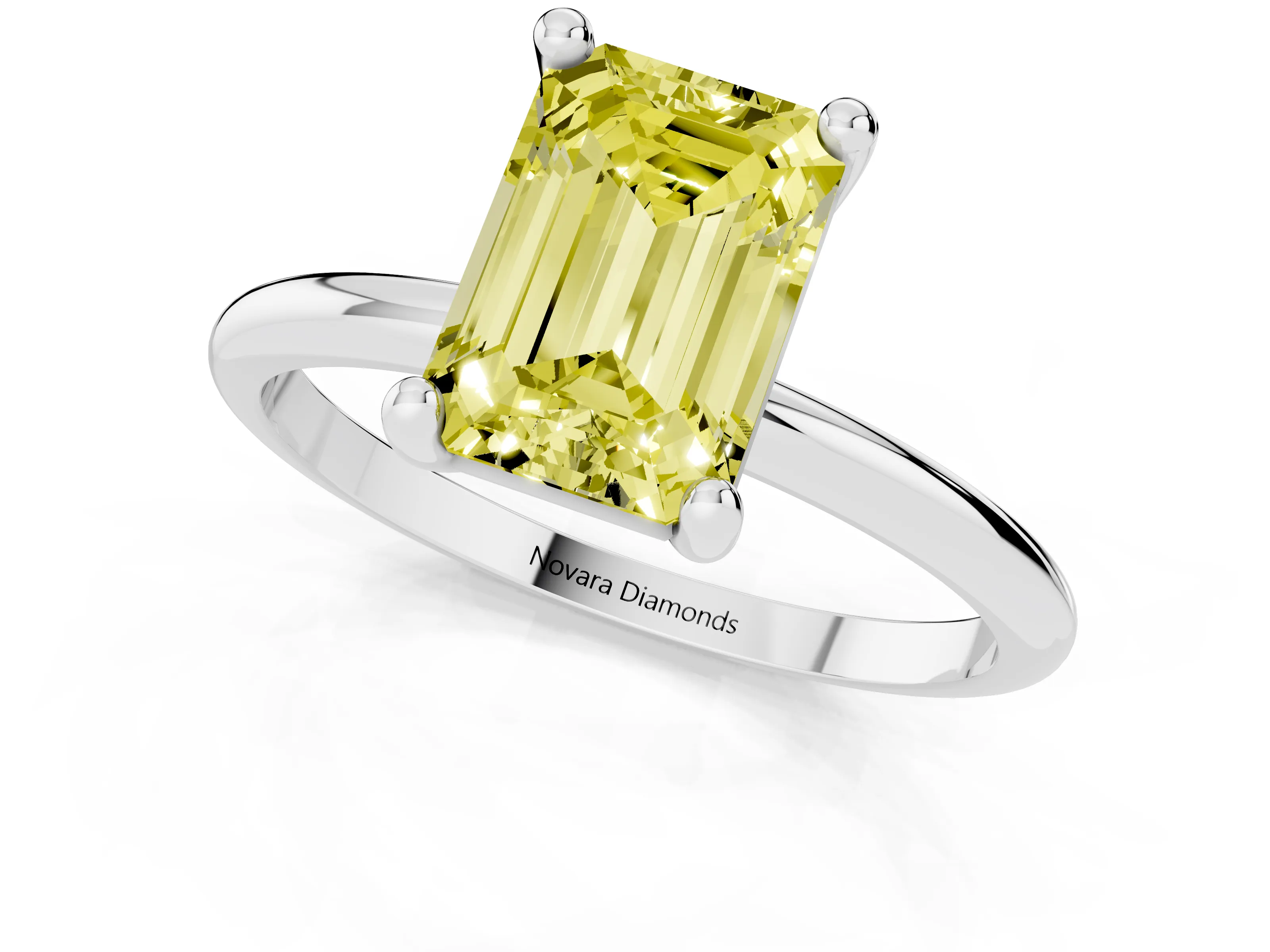 Fancy Yellow Emerald Cut Diamond Solitaire Ring Set in White gold with Secure Prong Setting on a Classic Band