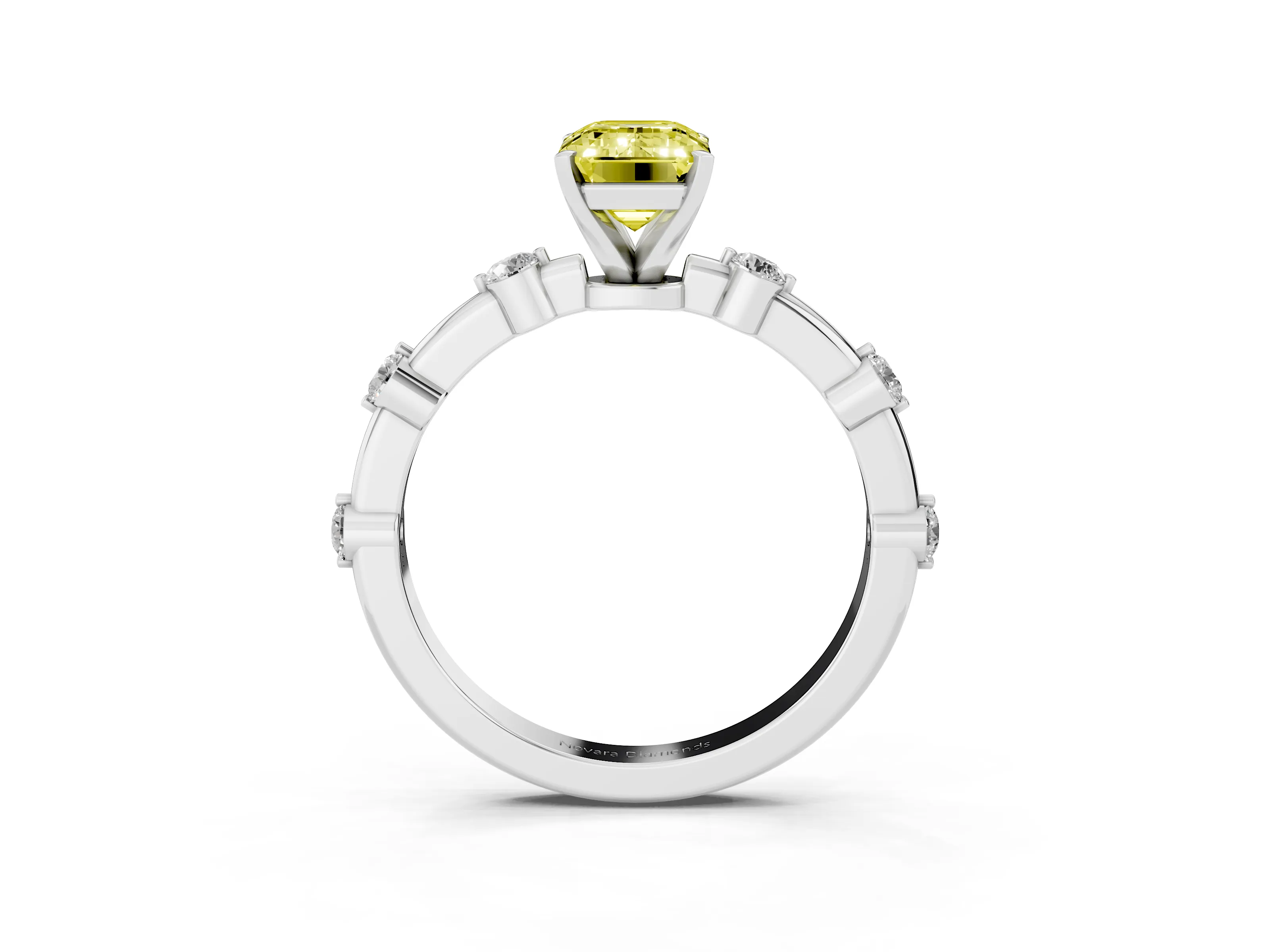 Fancy Yellow Emerald Cut Diamond Solitaire Ring Set in White gold with Bezel Set Side Stones and Prong Setting