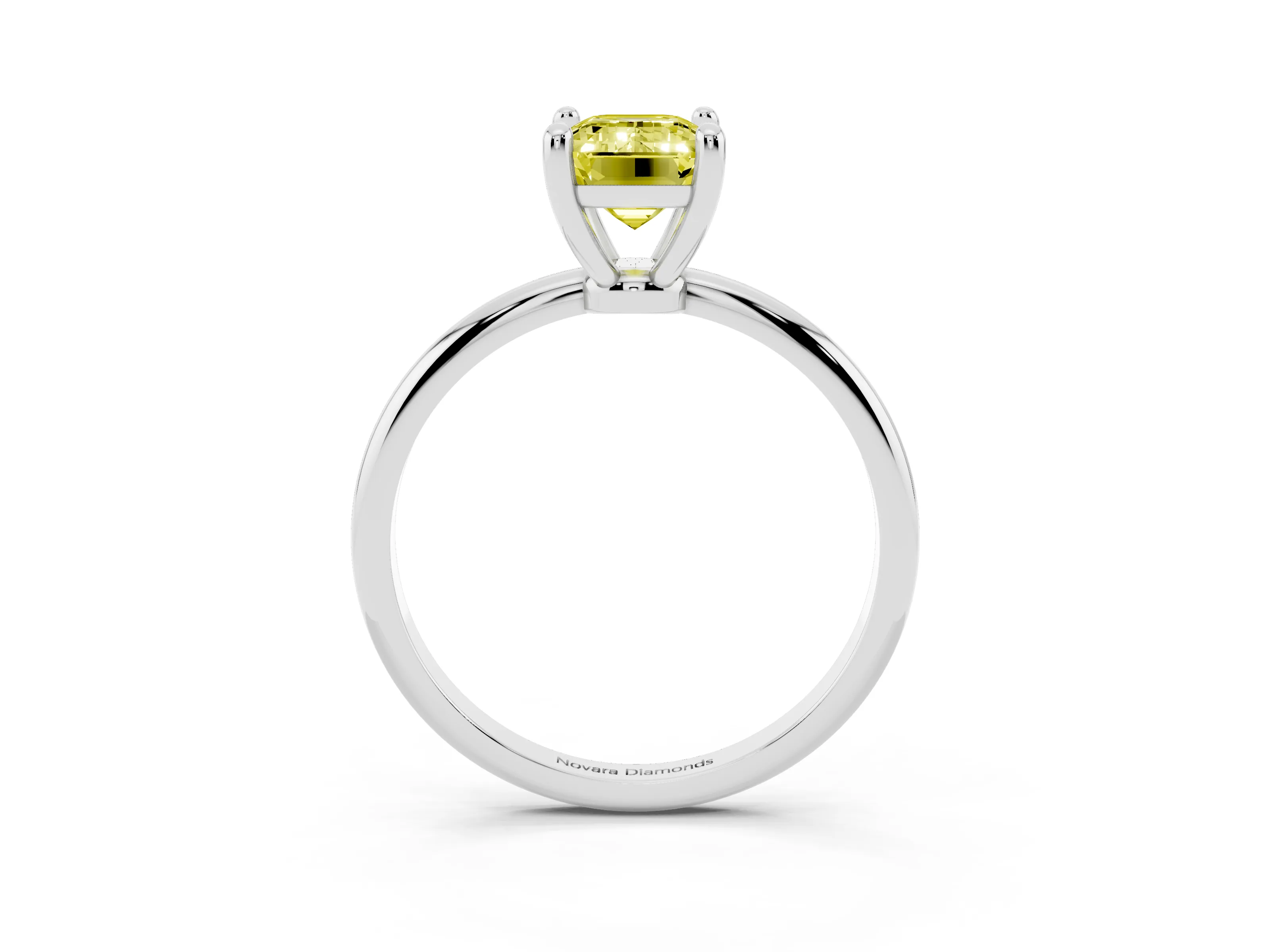 Fancy Yellow Emerald Cut Diamond Solitaire Ring Set in White gold with Secure Prong Setting on a Classic Band