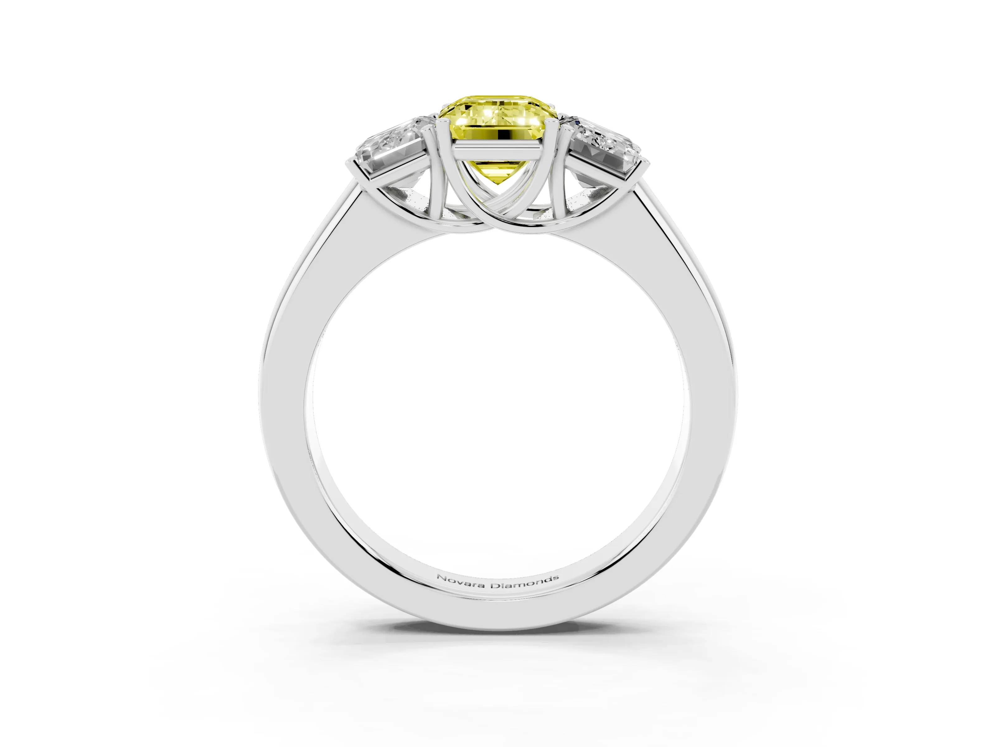 Fancy Yellow Three-Stone Emerald Cut Diamond Ring Set in White gold with Matching Prong Settings and Plain Band