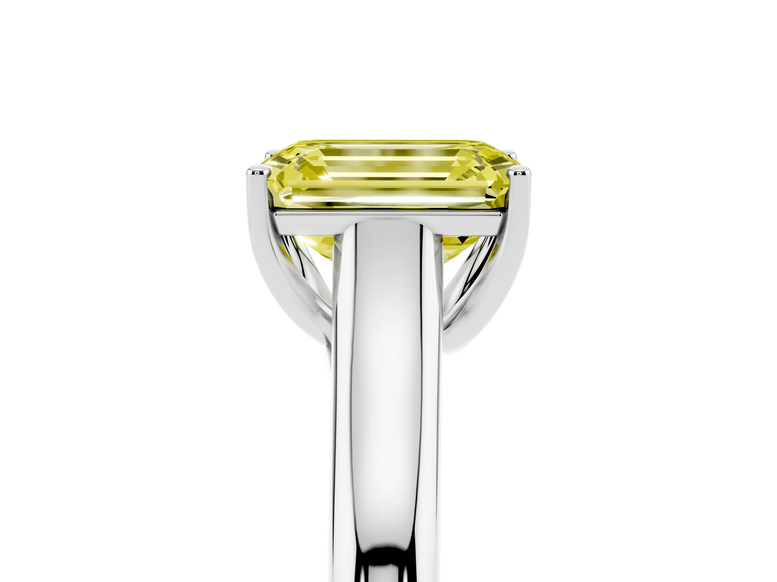 Fancy Yellow Emerald Cut Diamond Solitaire Engagement Ring Set in White gold with Subtly Tapered Band and Prong Setting
