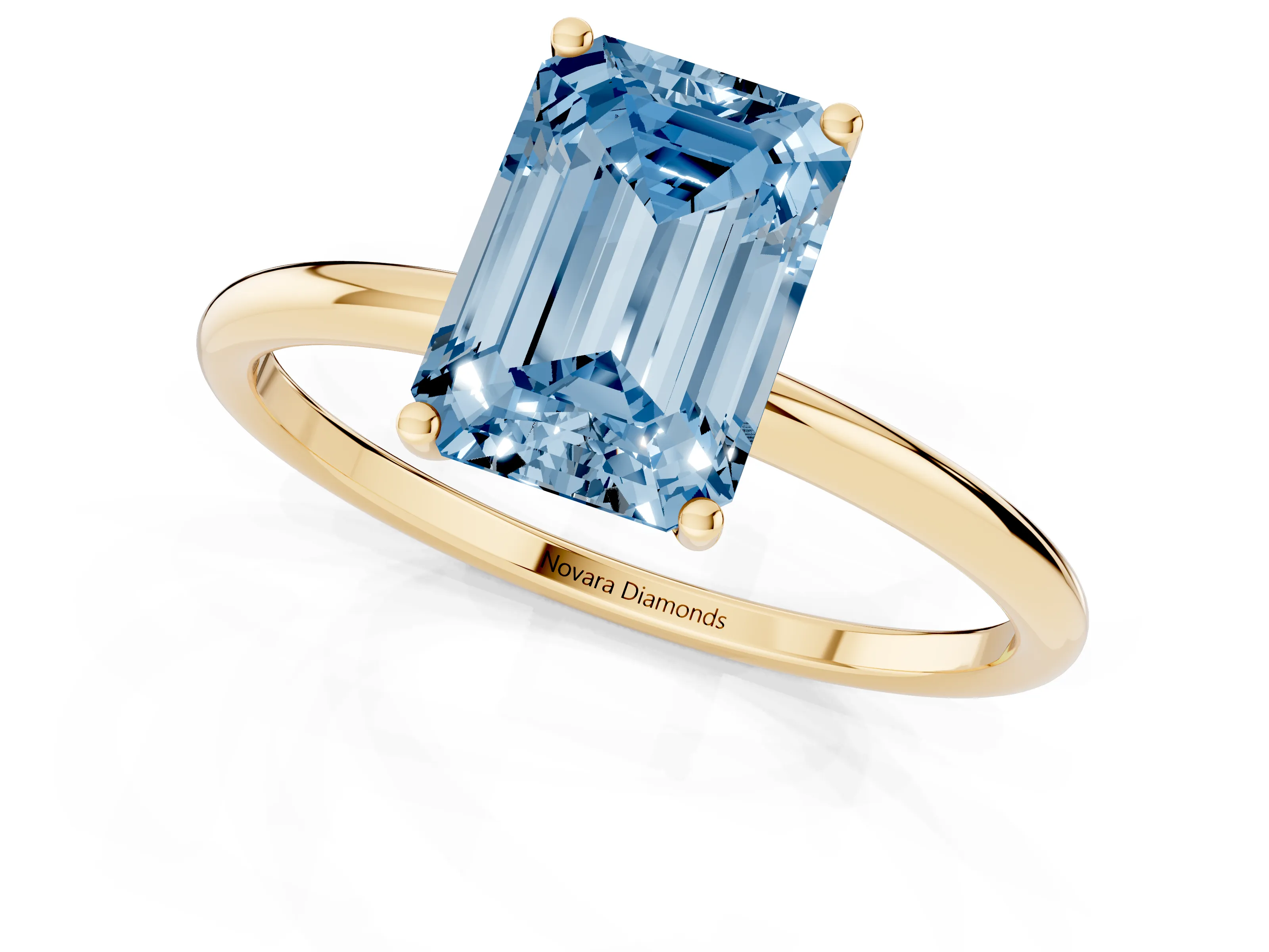 Fancy Blue Emerald Cut Diamond Solitaire Engagement Ring Set in Yellow gold with Thin Band and Prong Setting