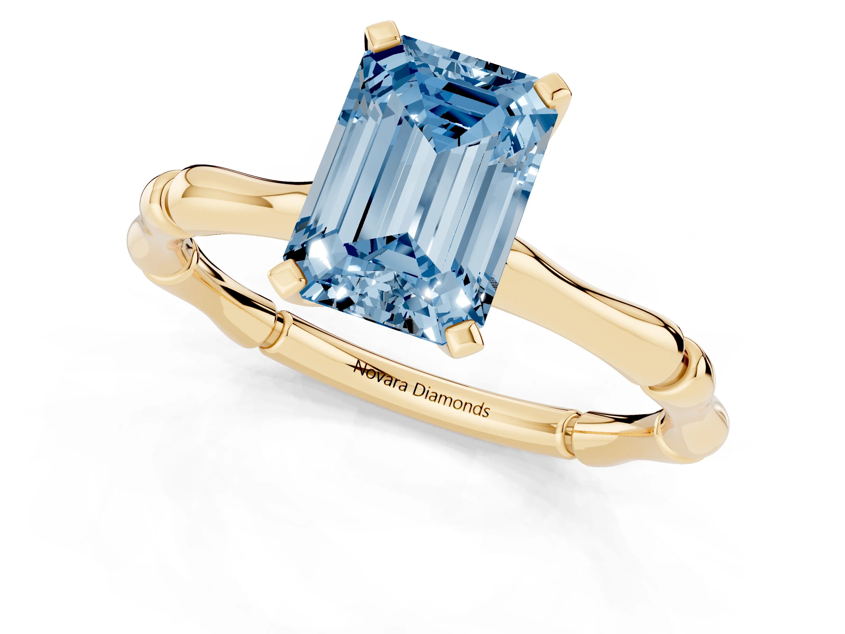 Fancy Blue Emerald Cut Diamond Solitaire Ring Set in Yellow gold with Bamboo Band and Prong Setting