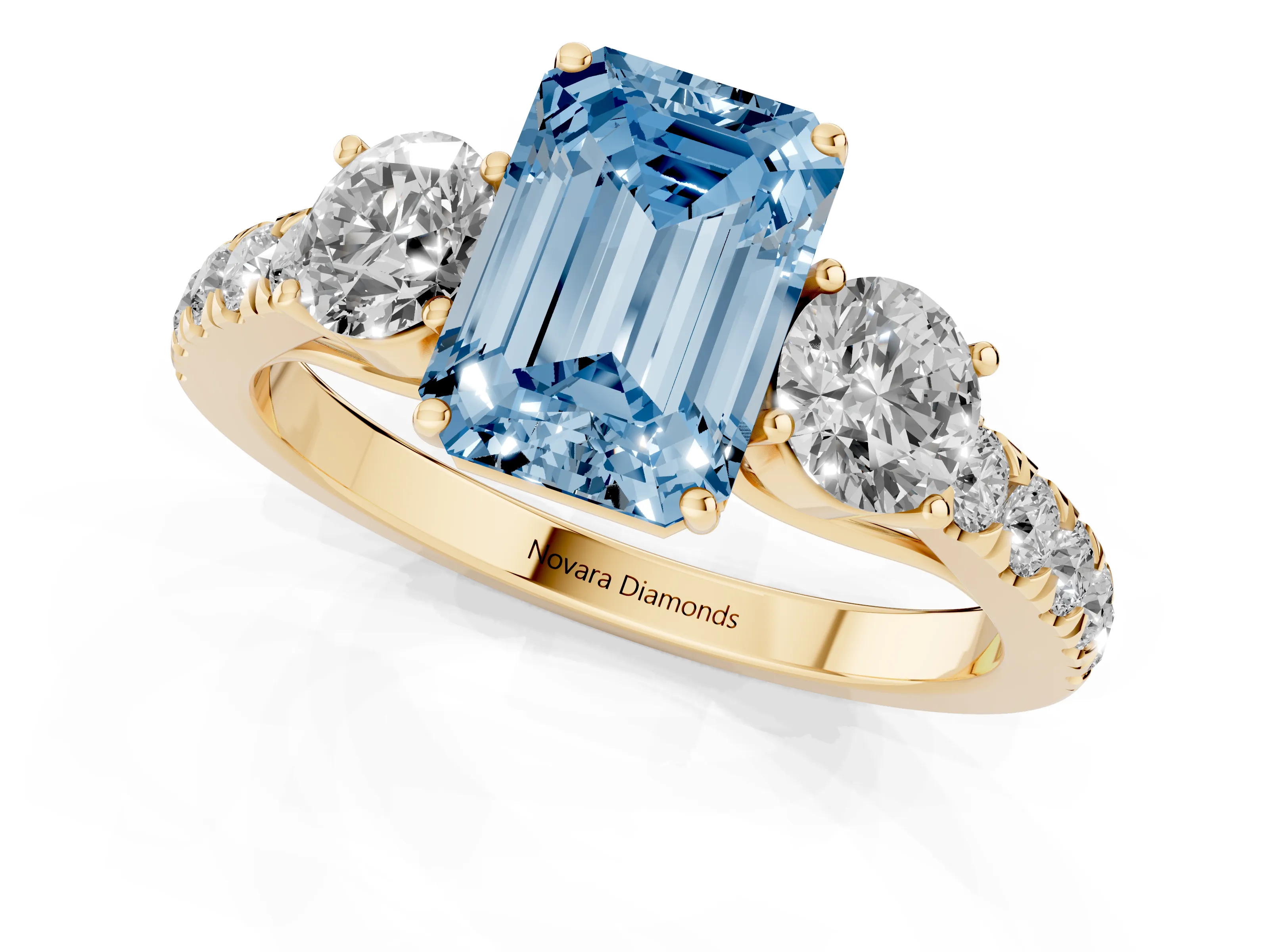 Fancy Blue Emerald Cut Diamond Three-Stone Ring Set in Yellow gold with Round Side Stones and Delicate Pavé Band