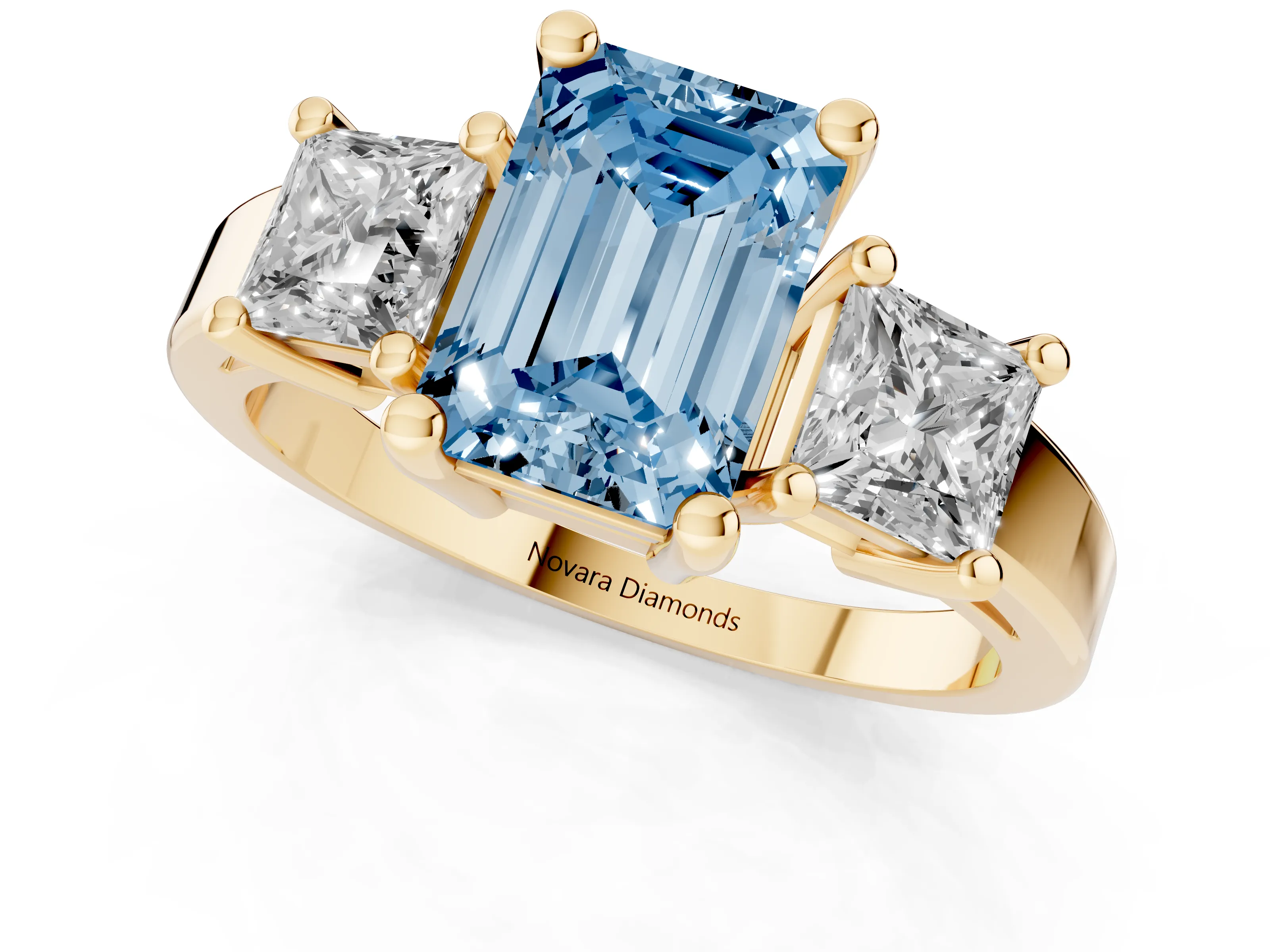Fancy Blue Three-Stone Emerald Cut Diamond Solitaire Ring Set in Yellow gold with Prong Setting
