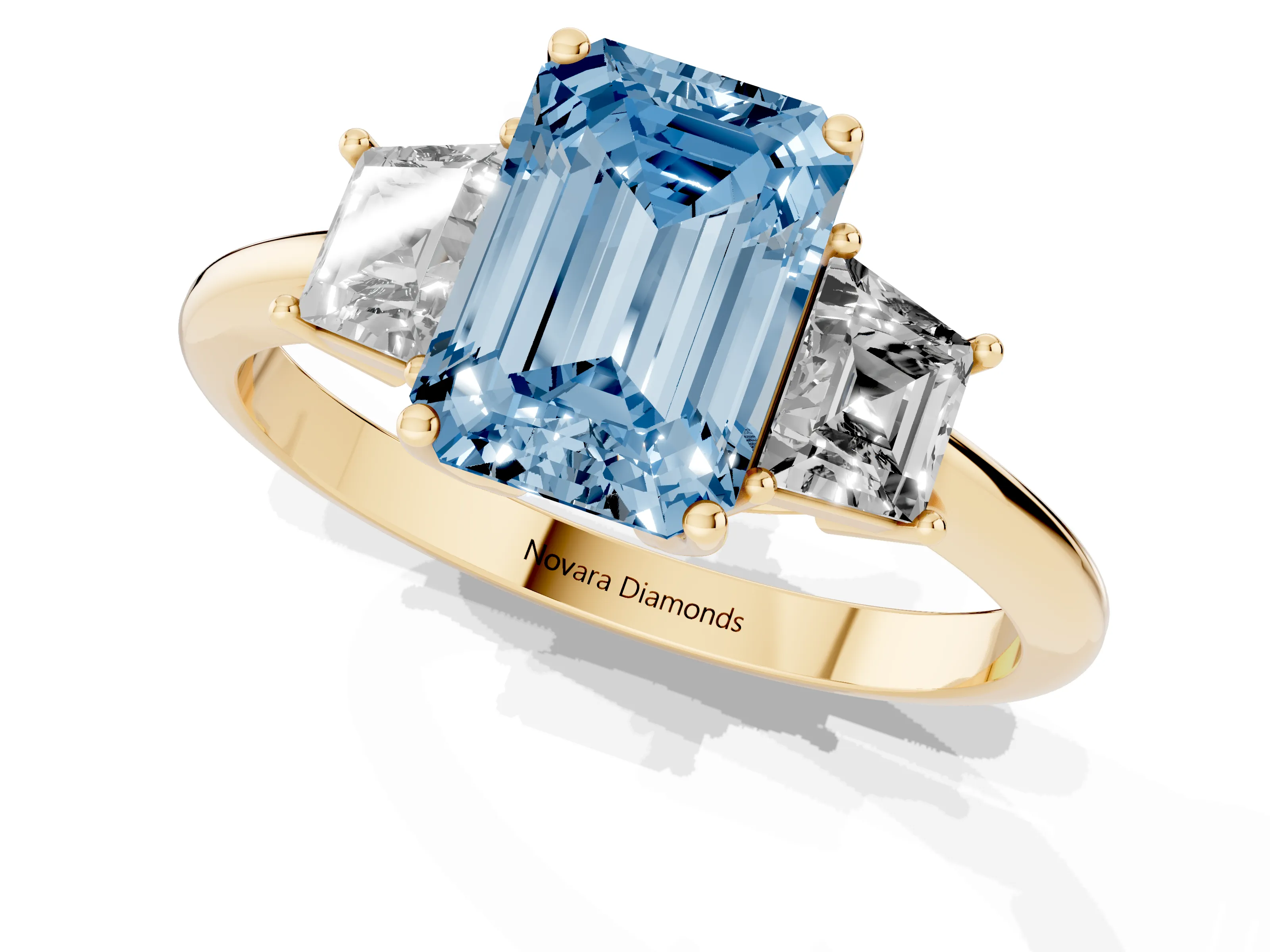 Fancy Blue Emerald Cut Diamond Three-Stone Ring Set in Yellow gold with Trapezoid Side Stones and Prong Setting