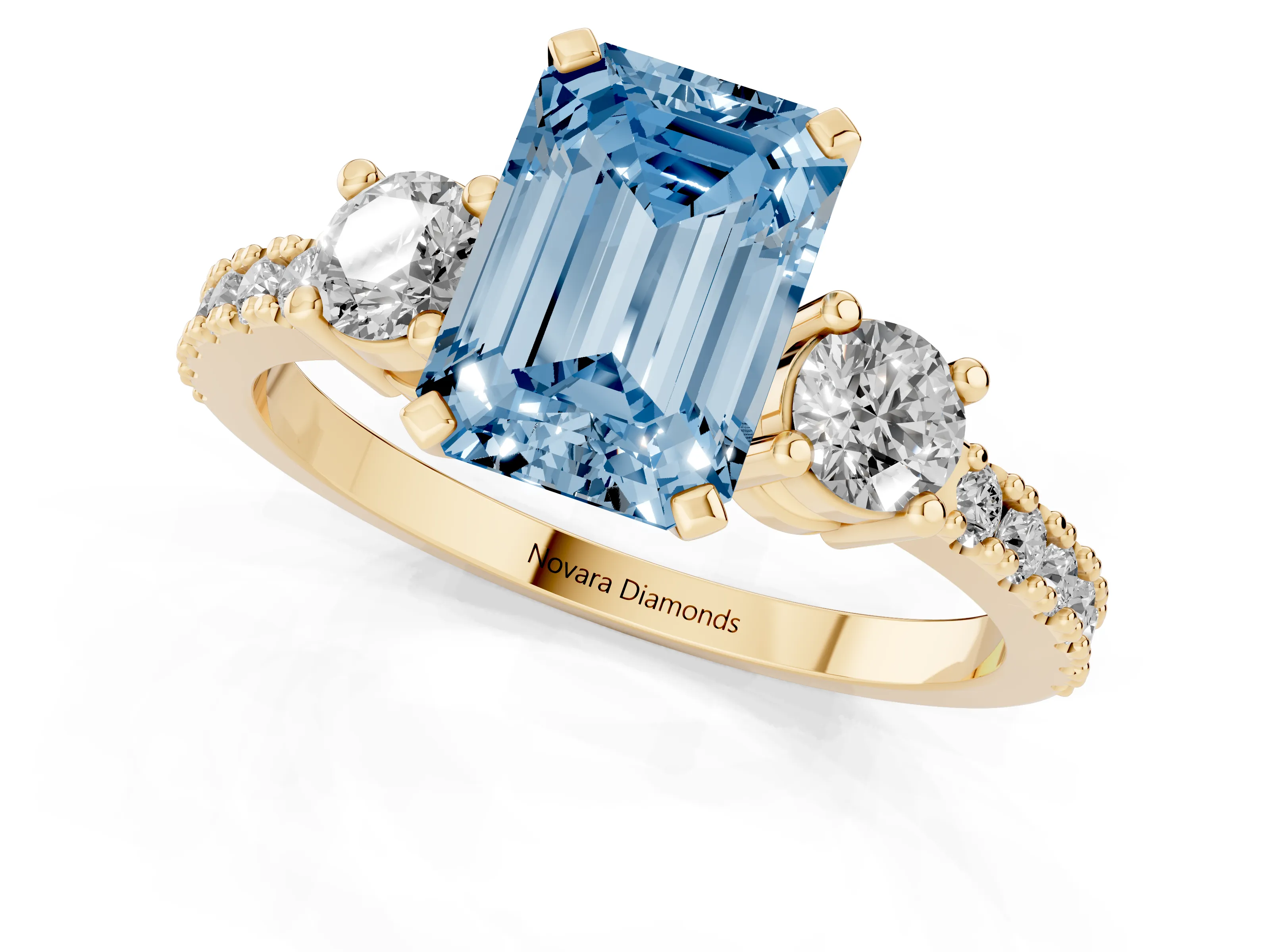 Fancy Blue Three-Stone Emerald Cut Diamond Pavé Band Ring Set in Yellow gold with Prong Setting