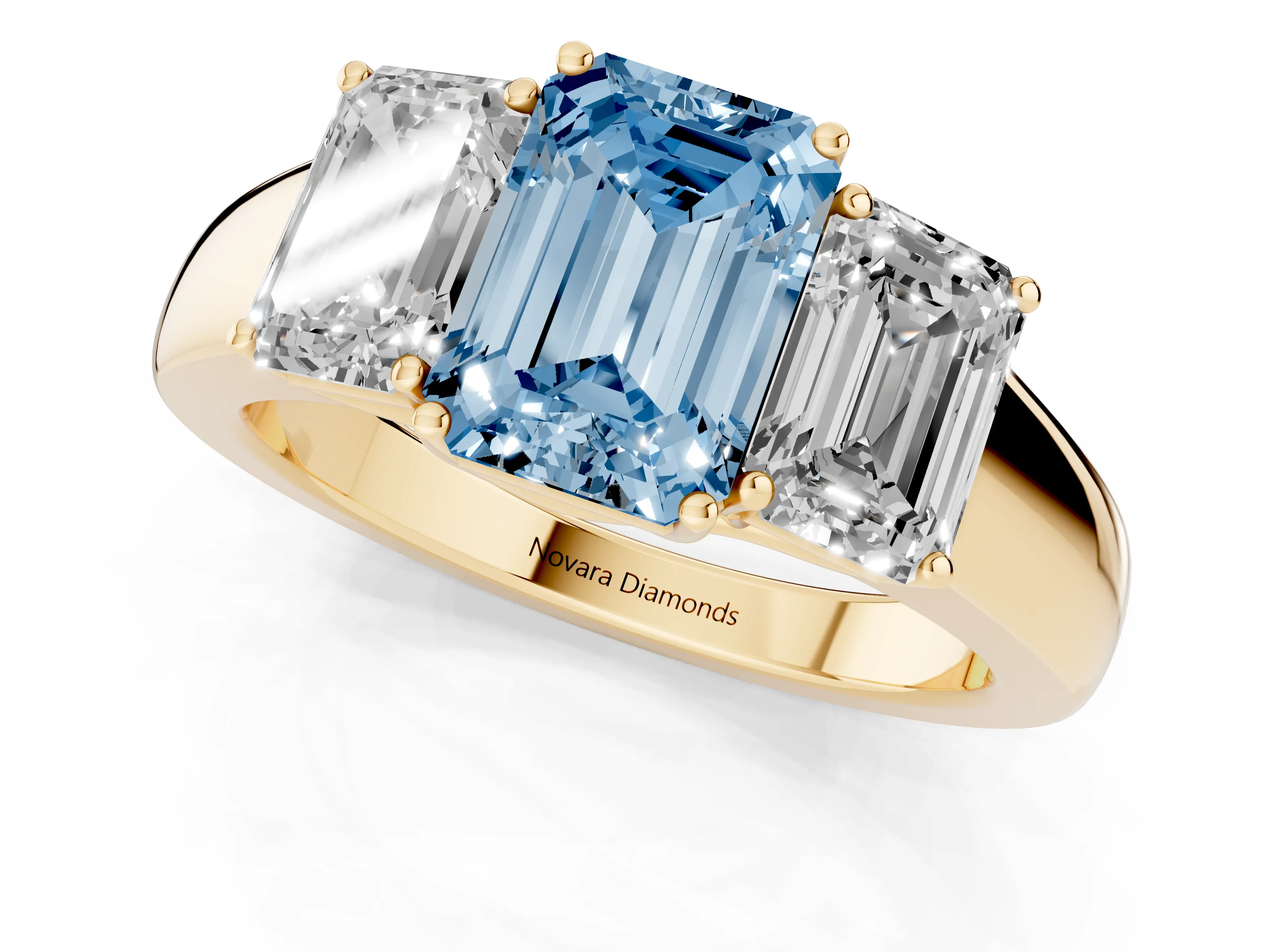 Fancy Blue Three-Stone Emerald Cut Diamond Ring Set in Yellow gold with Matching Prong Settings and Plain Band