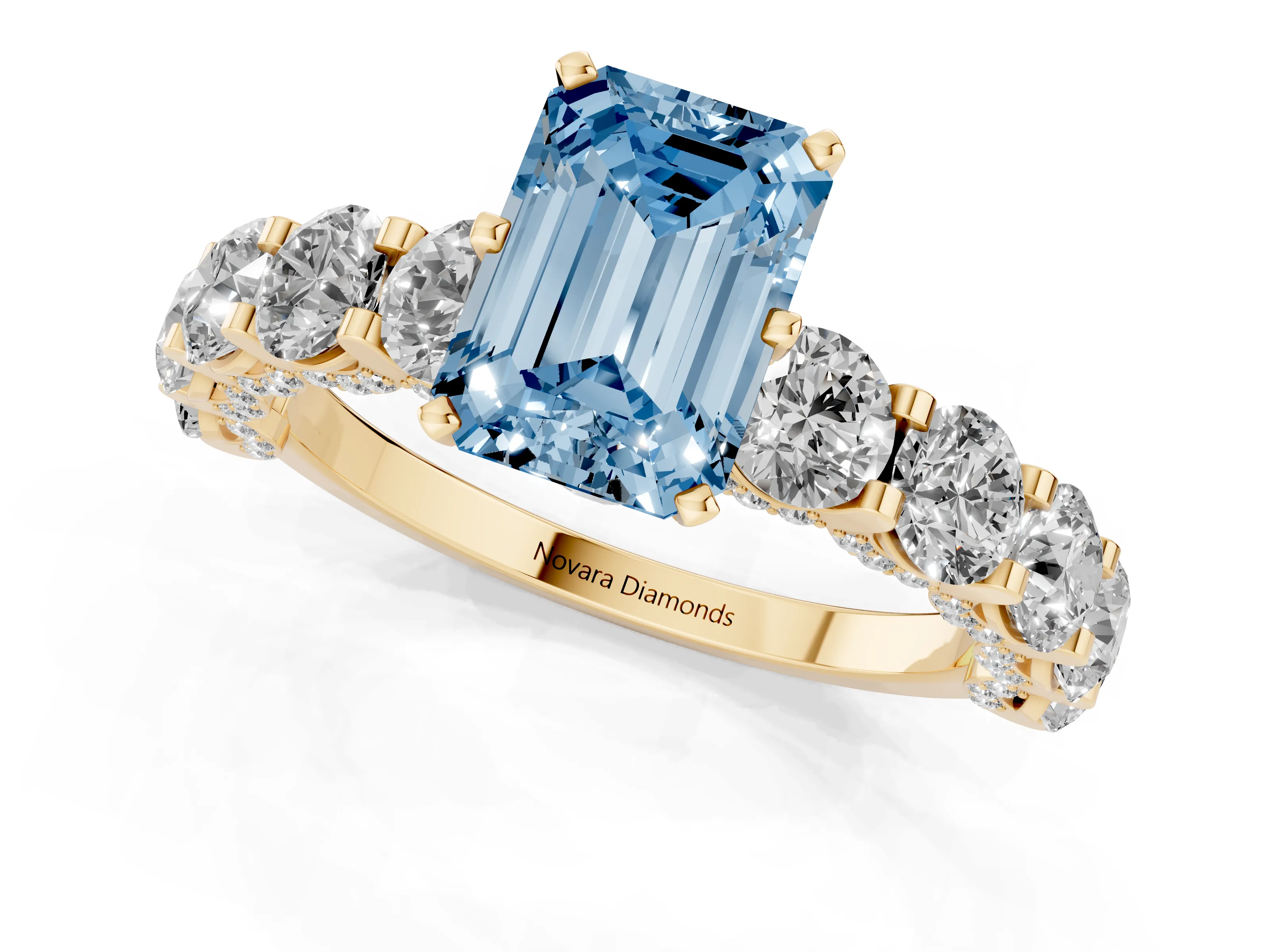 Fancy Blue Emerald Cut Diamond Side Stone Ring Set in Yellow gold with Alternating Round and Oval Side Stones