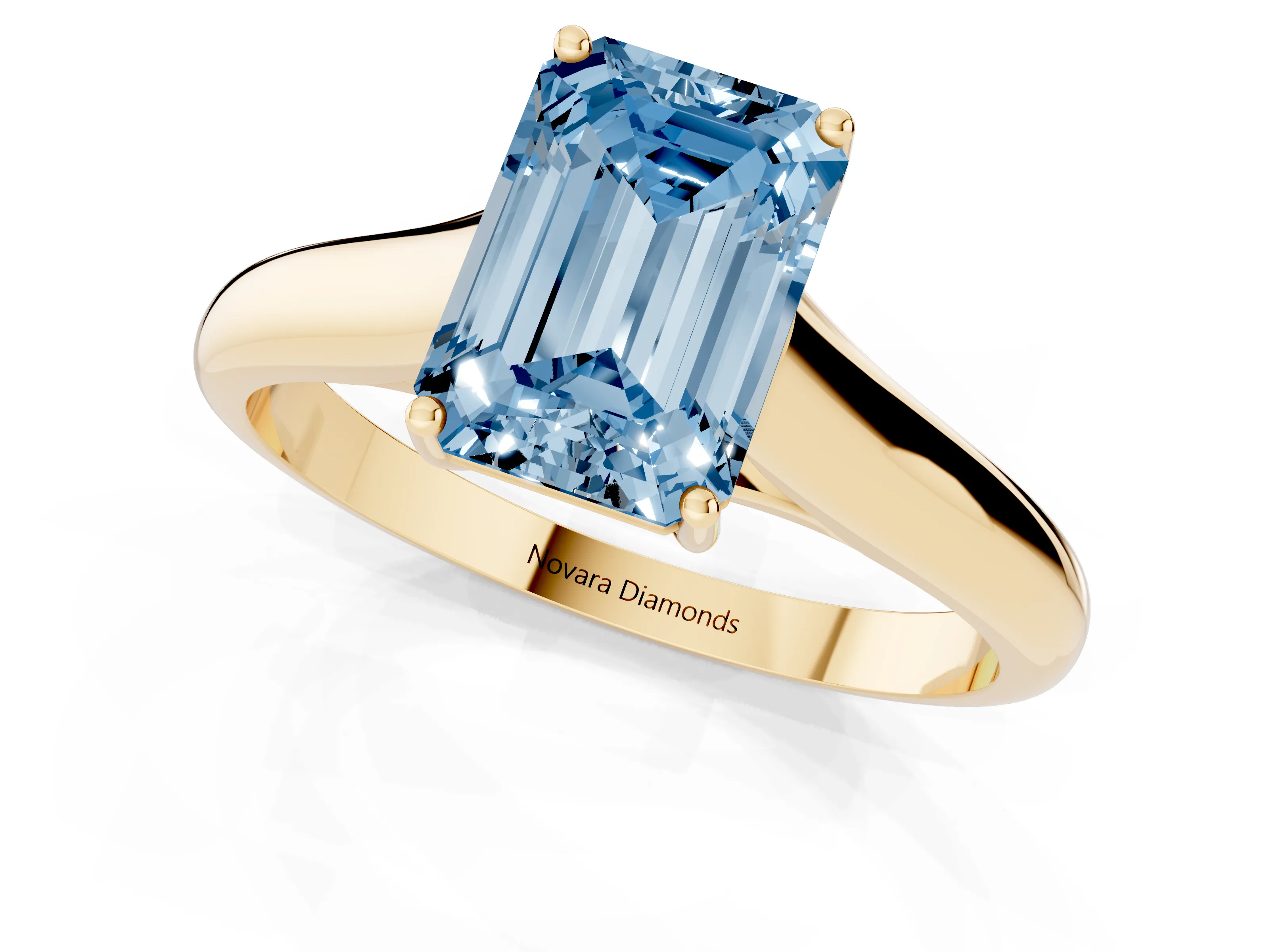 Fancy Blue Emerald Cut Diamond Solitaire Engagement Ring Set in Yellow gold with Subtly Tapered Band and Prong Setting