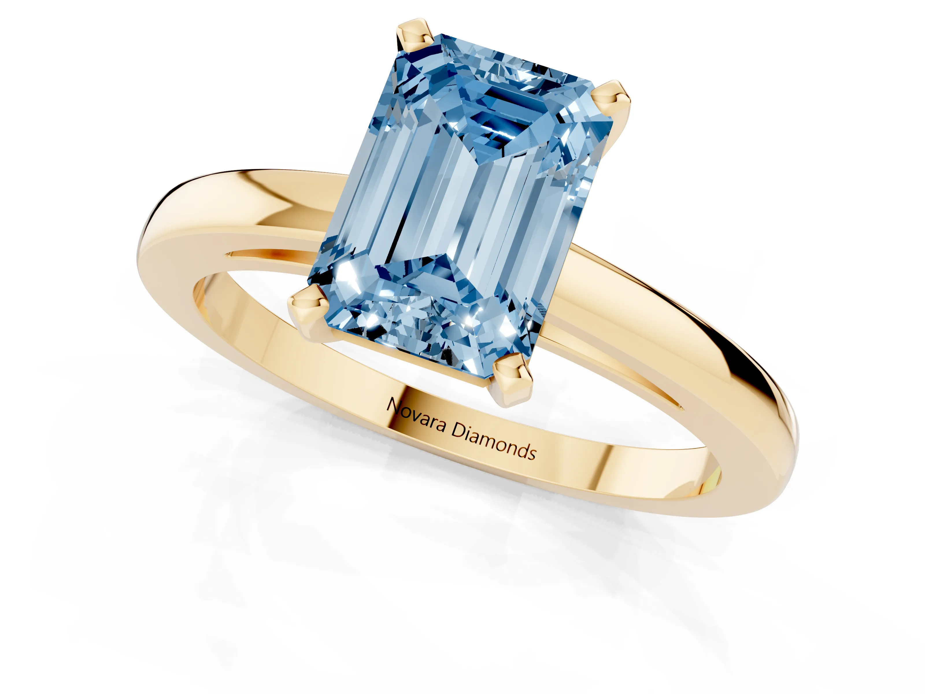 Fancy Blue Emerald Cut Diamond Solitaire Engagement Ring Set in Yellow gold with Prong Setting on a Classic Band