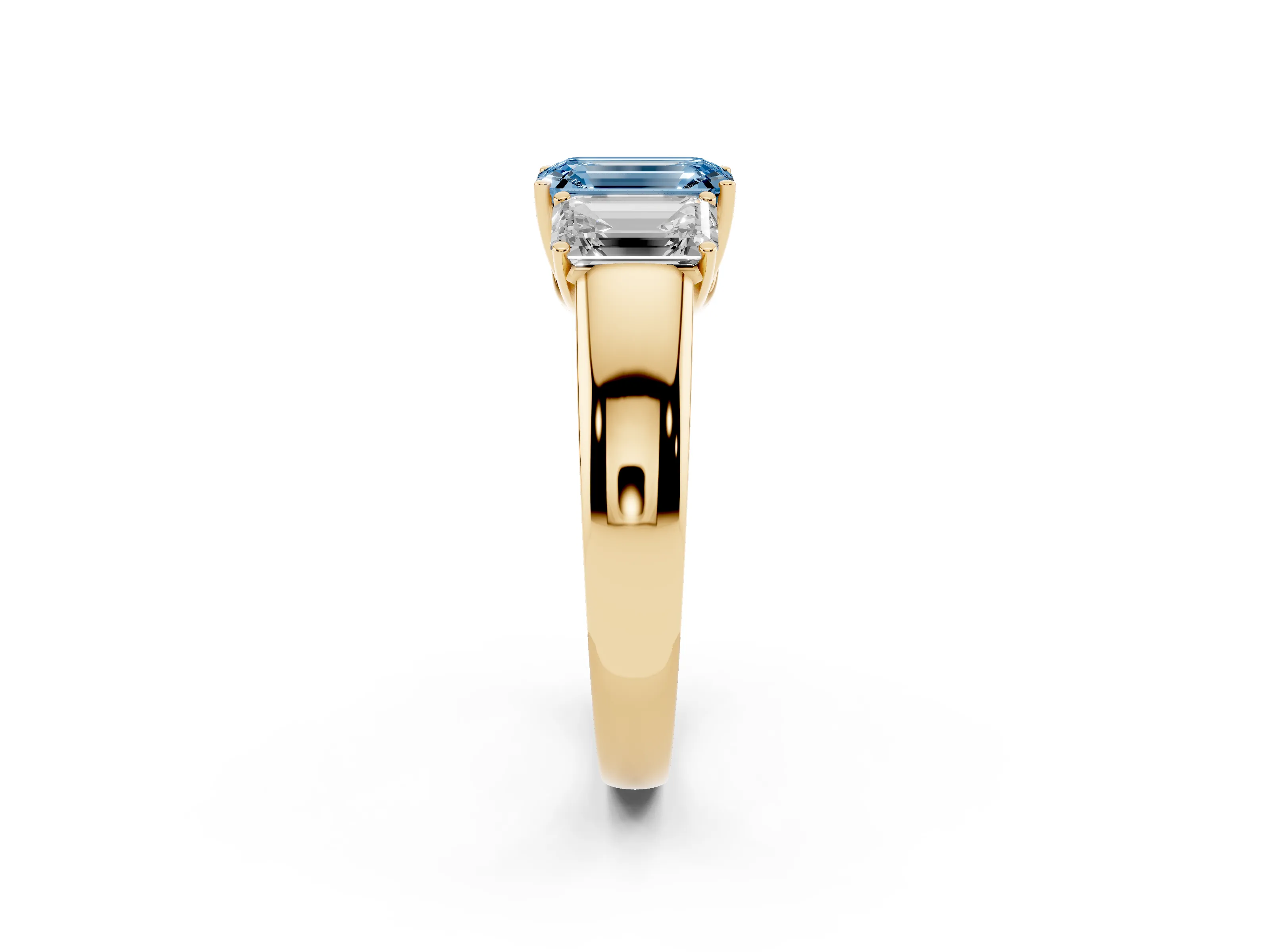 Fancy Blue Three-Stone Emerald Cut Diamond Ring Set in Yellow gold with Matching Prong Settings and Plain Band