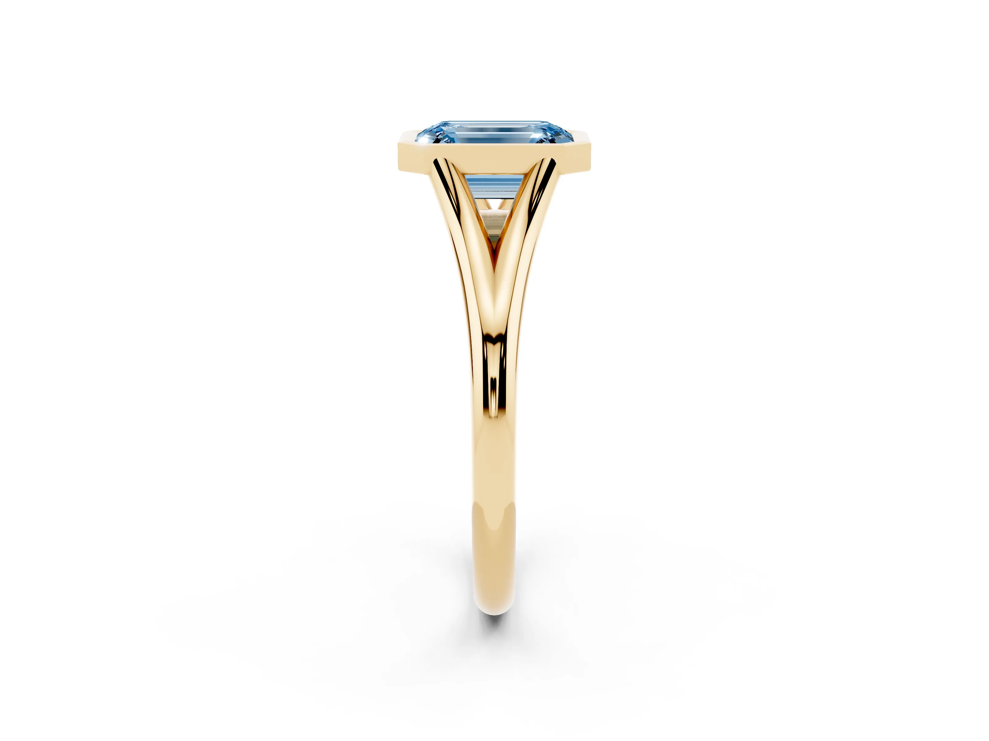 Fancy Blue Bezel Set Emerald Cut Diamond Solitaire Ring Set in Yellow gold with Tapered Band