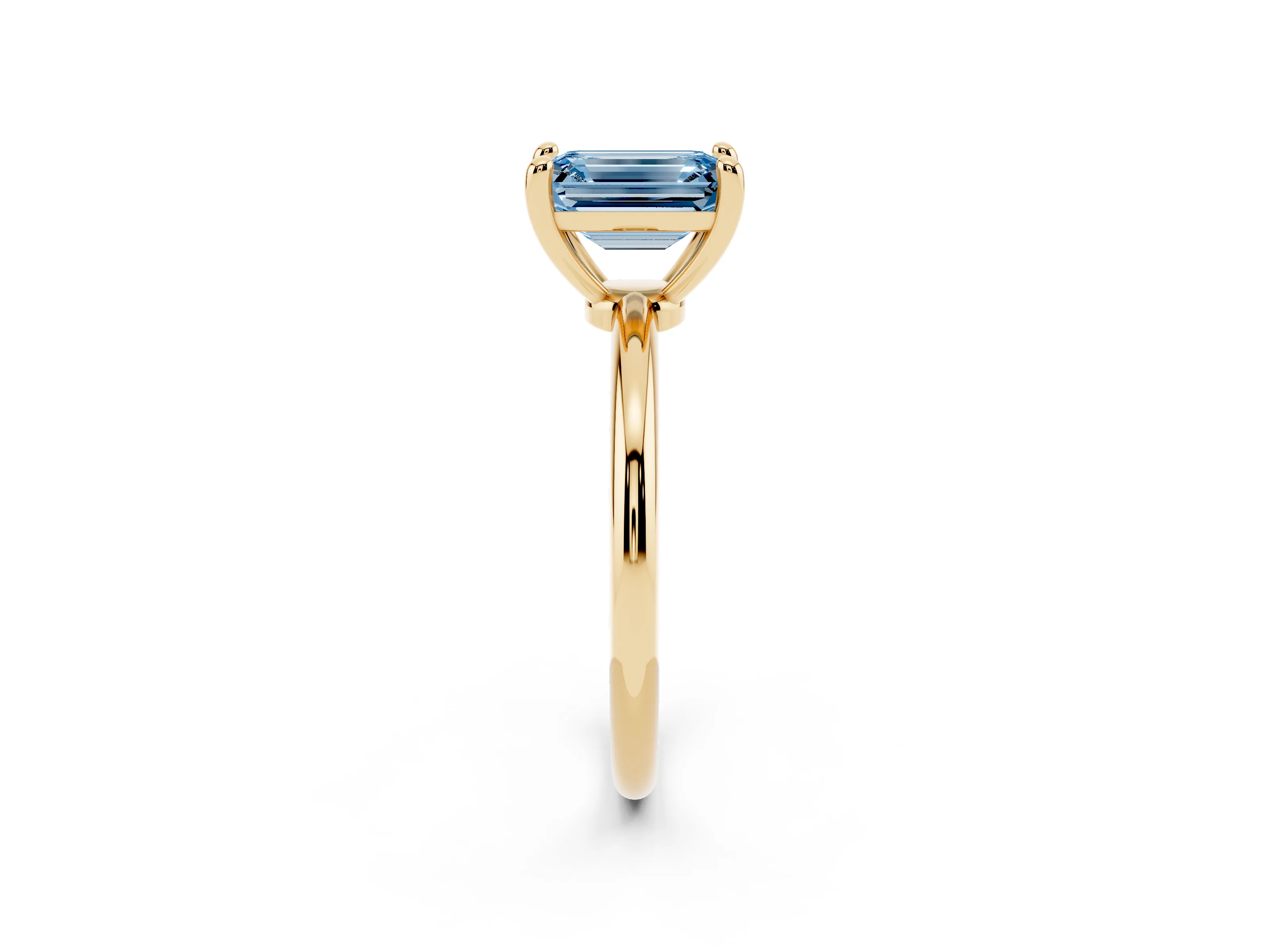 Fancy Blue Emerald Cut Diamond Solitaire Ring Set in Yellow gold with Secure Prong Setting on a Classic Band