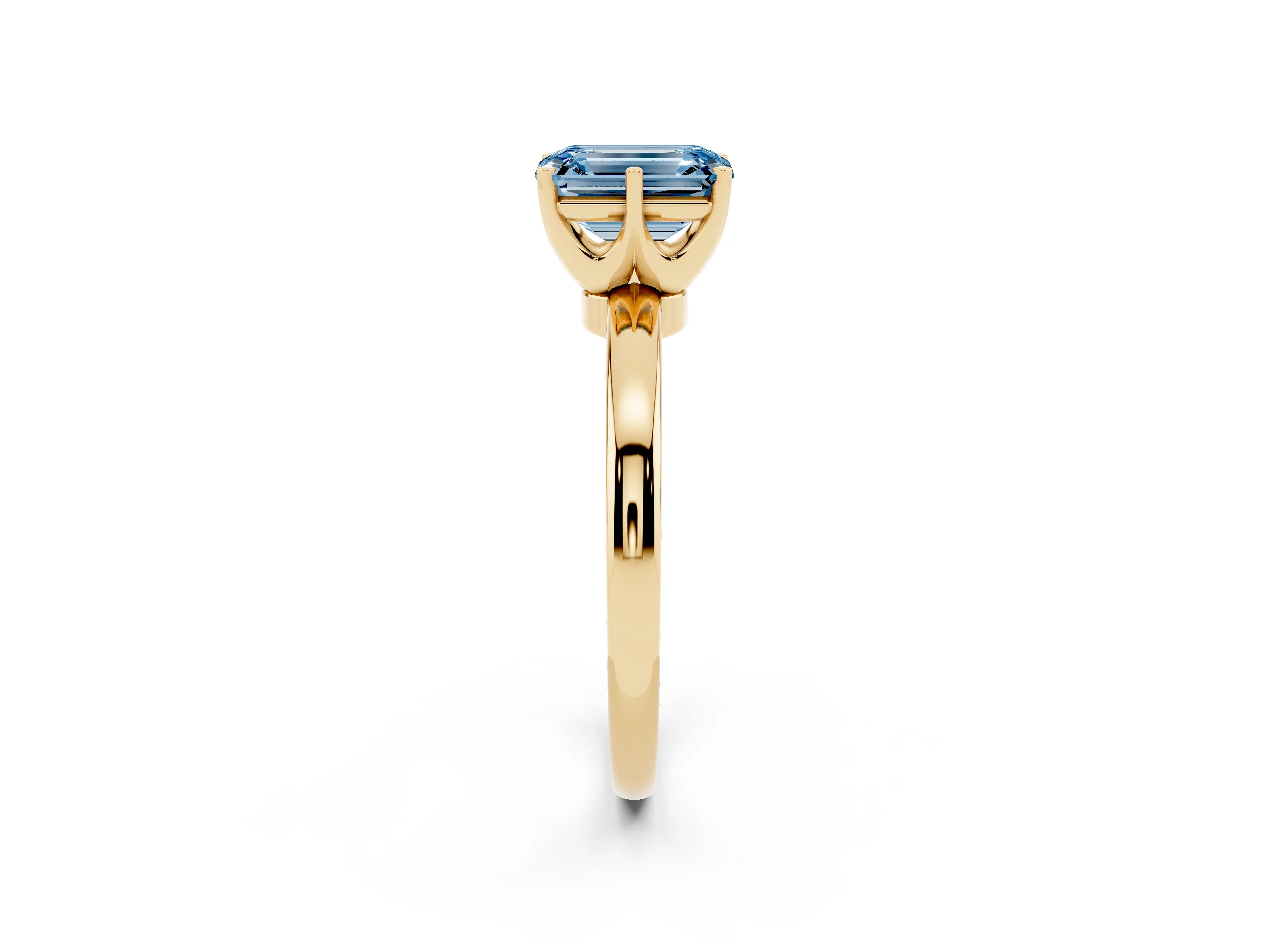 Fancy Blue Emerald Cut Diamond Solitaire Ring Set in Yellow gold with Raised Prong Setting on a Classic Band
