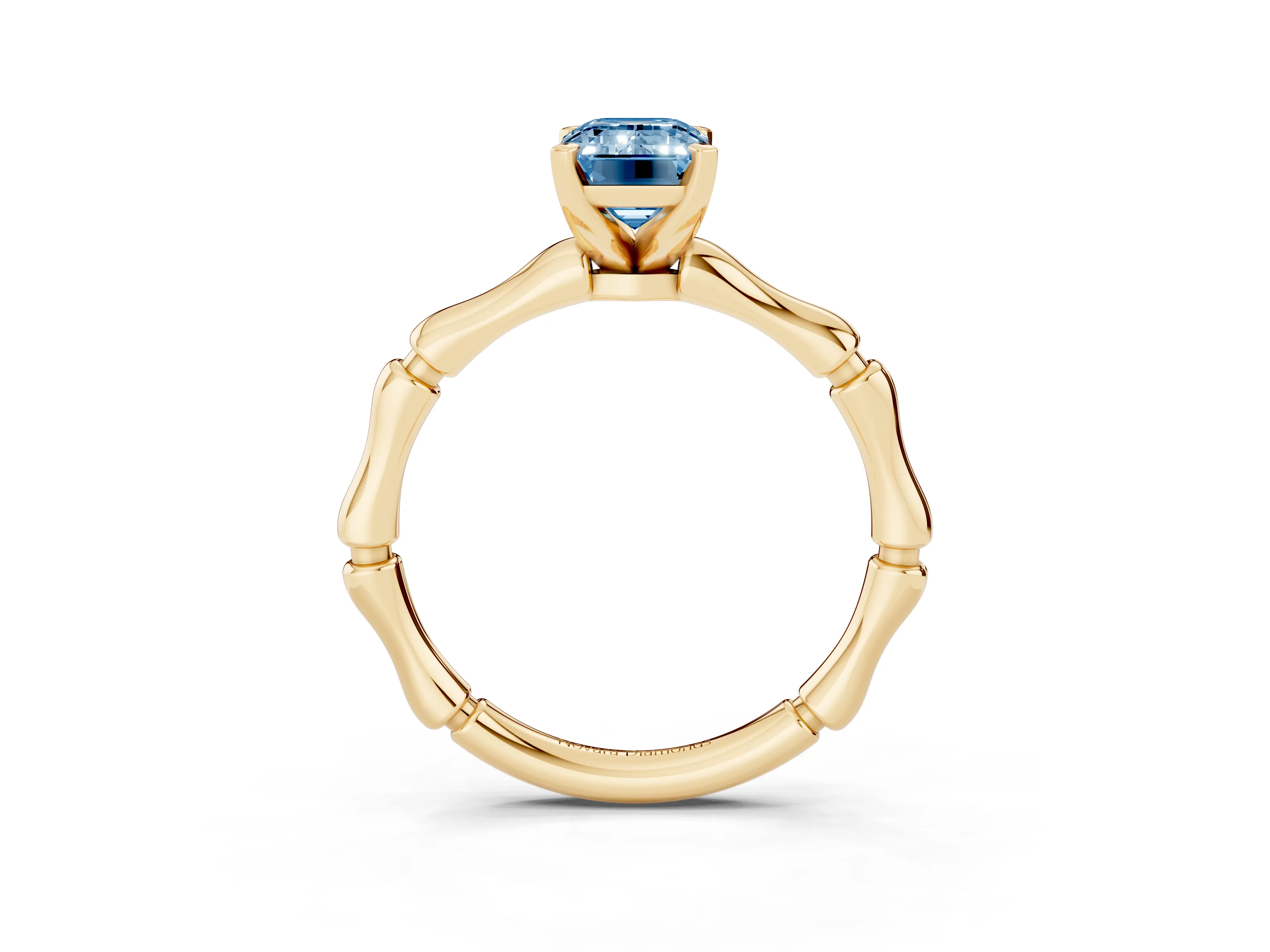 Fancy Blue Emerald Cut Diamond Solitaire Ring Set in Yellow gold with Bamboo Band and Prong Setting