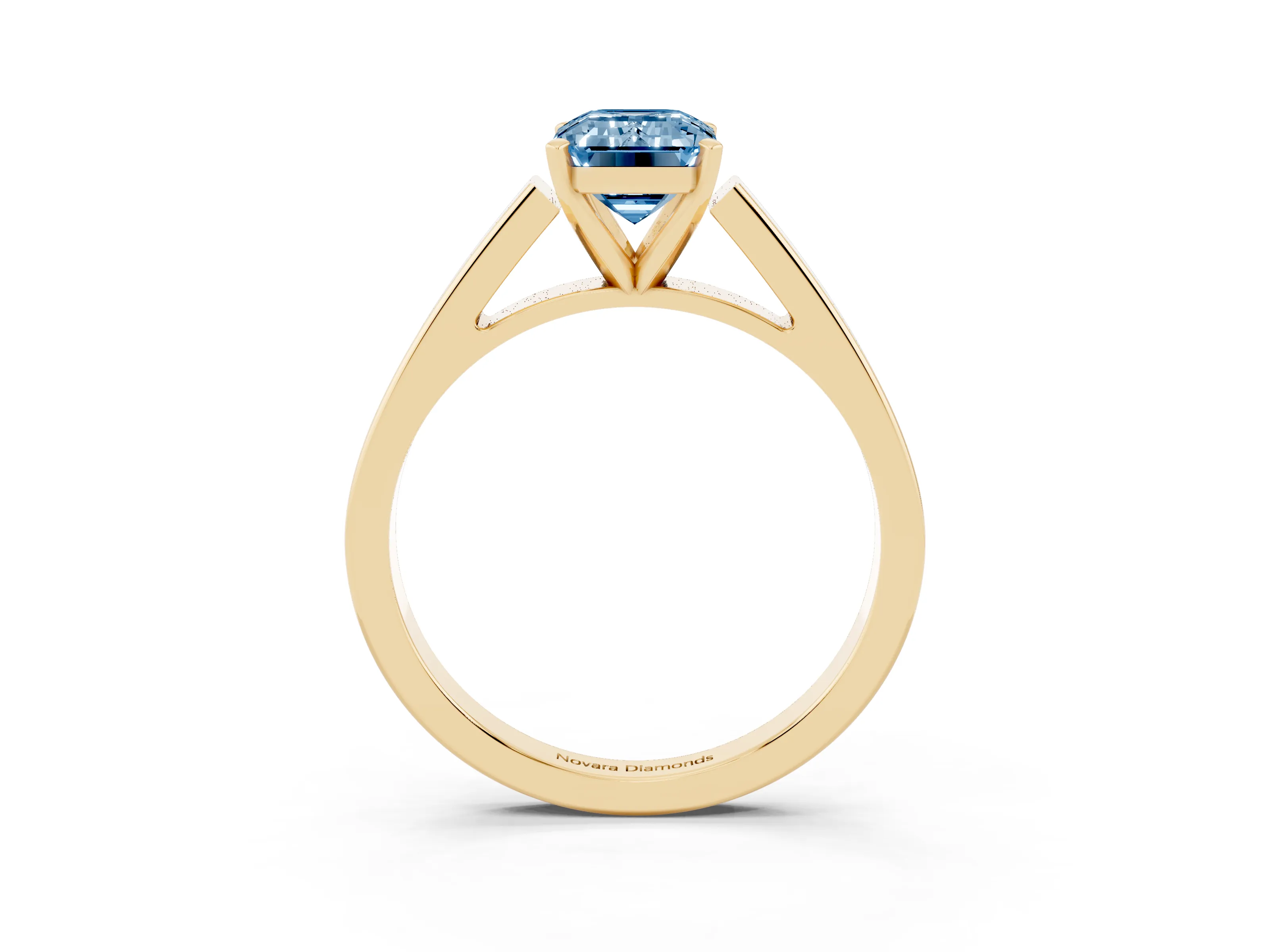 Fancy Blue Emerald Cut Diamond Solitaire Engagement Ring Set in Yellow gold with Prong Setting and Tapered Band