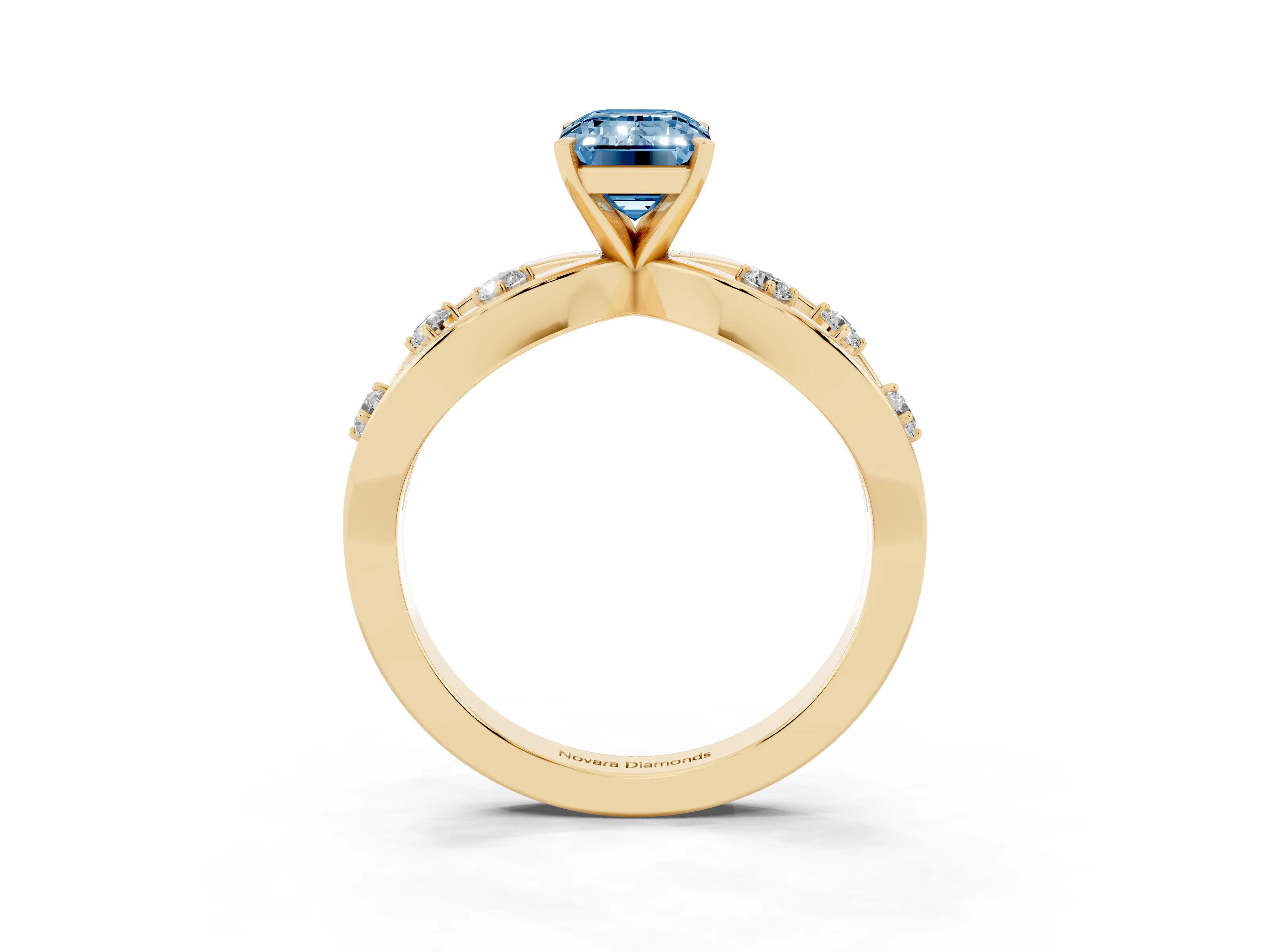 Fancy Blue Emerald Cut Diamond Solitaire Ring Set in Yellow gold with Side Stones on Criss-Cross Band and Prong Setting