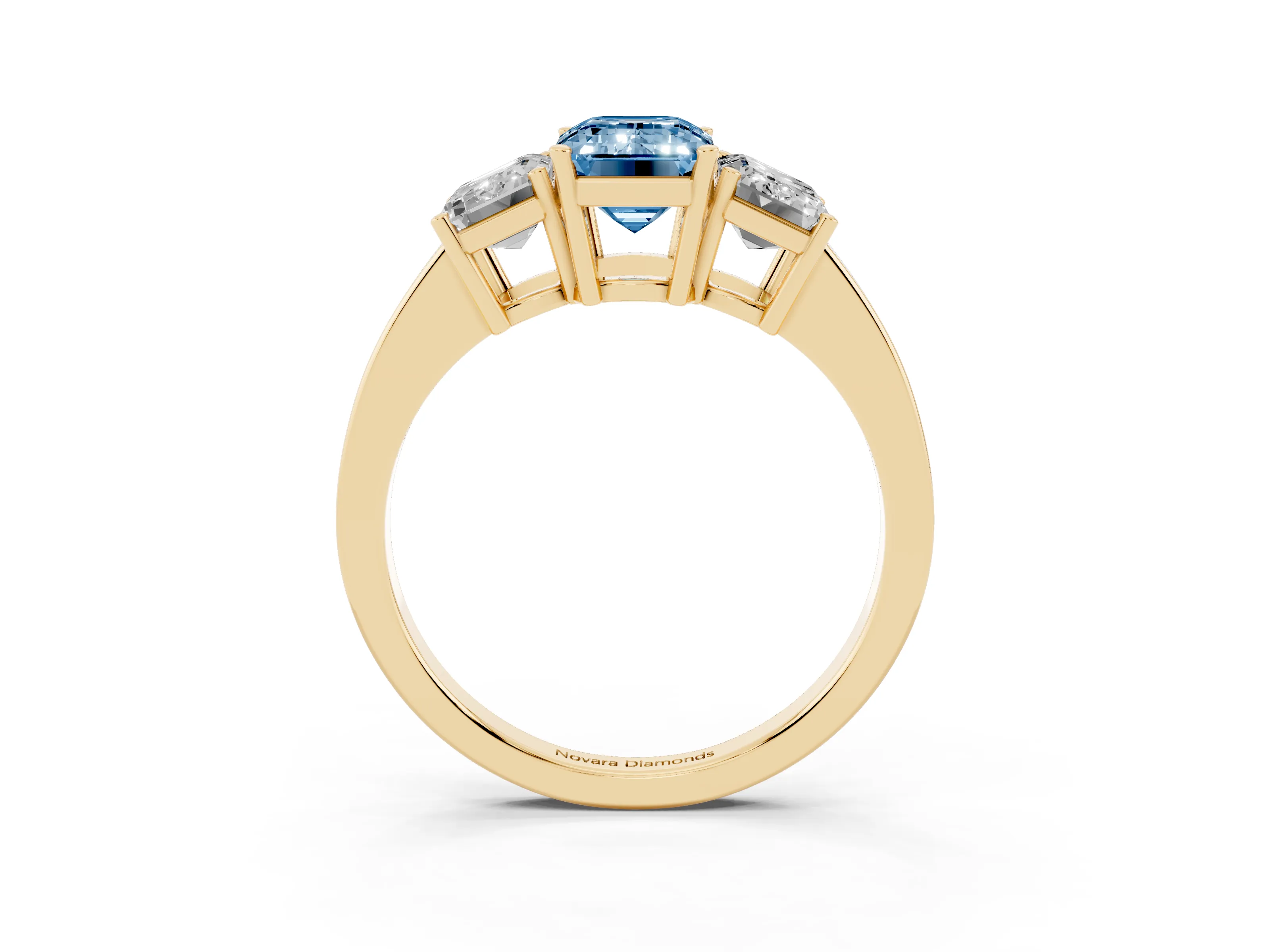 Fancy Blue Emerald Cut Diamond Three-Stone Engagement Ring Set in Yellow gold with Flat Band