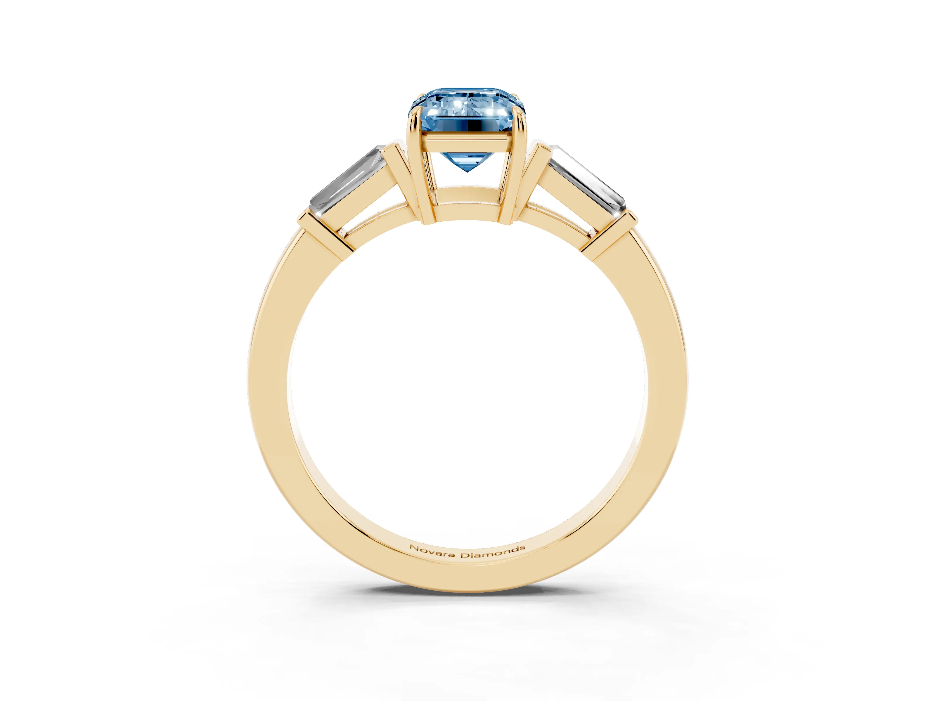 Fancy Blue Emerald Cut Diamond Three-Stone Ring Set in Yellow gold with Tapered Baguette Side Stones and Prong Setting