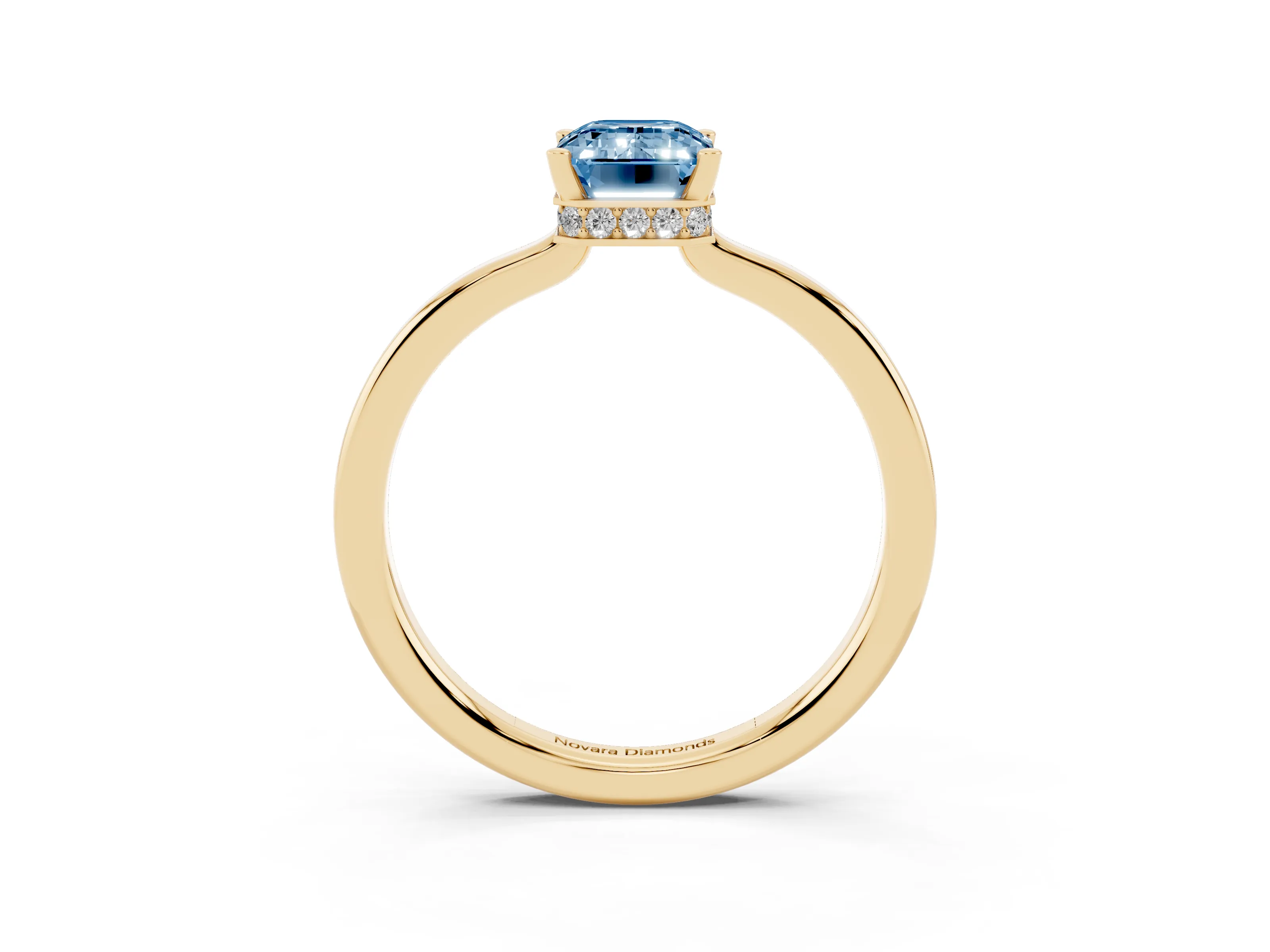 Fancy Blue Emerald Cut Diamond Solitaire Engagement Ring Set in Yellow gold with Prong Setting on a Plain Band