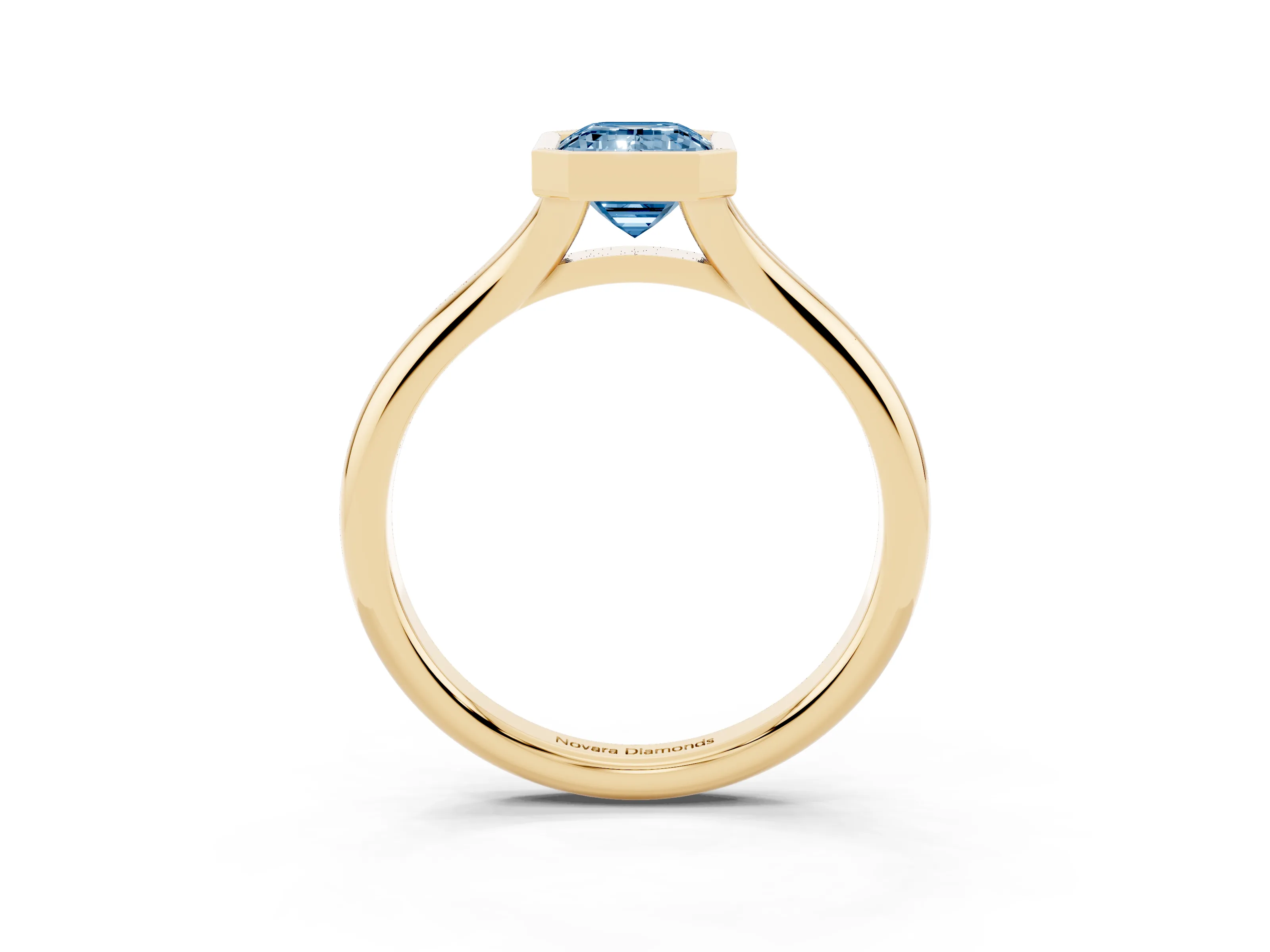 Fancy Blue Bezel Set Emerald Cut Diamond Solitaire Ring Set in Yellow gold with Smooth Band