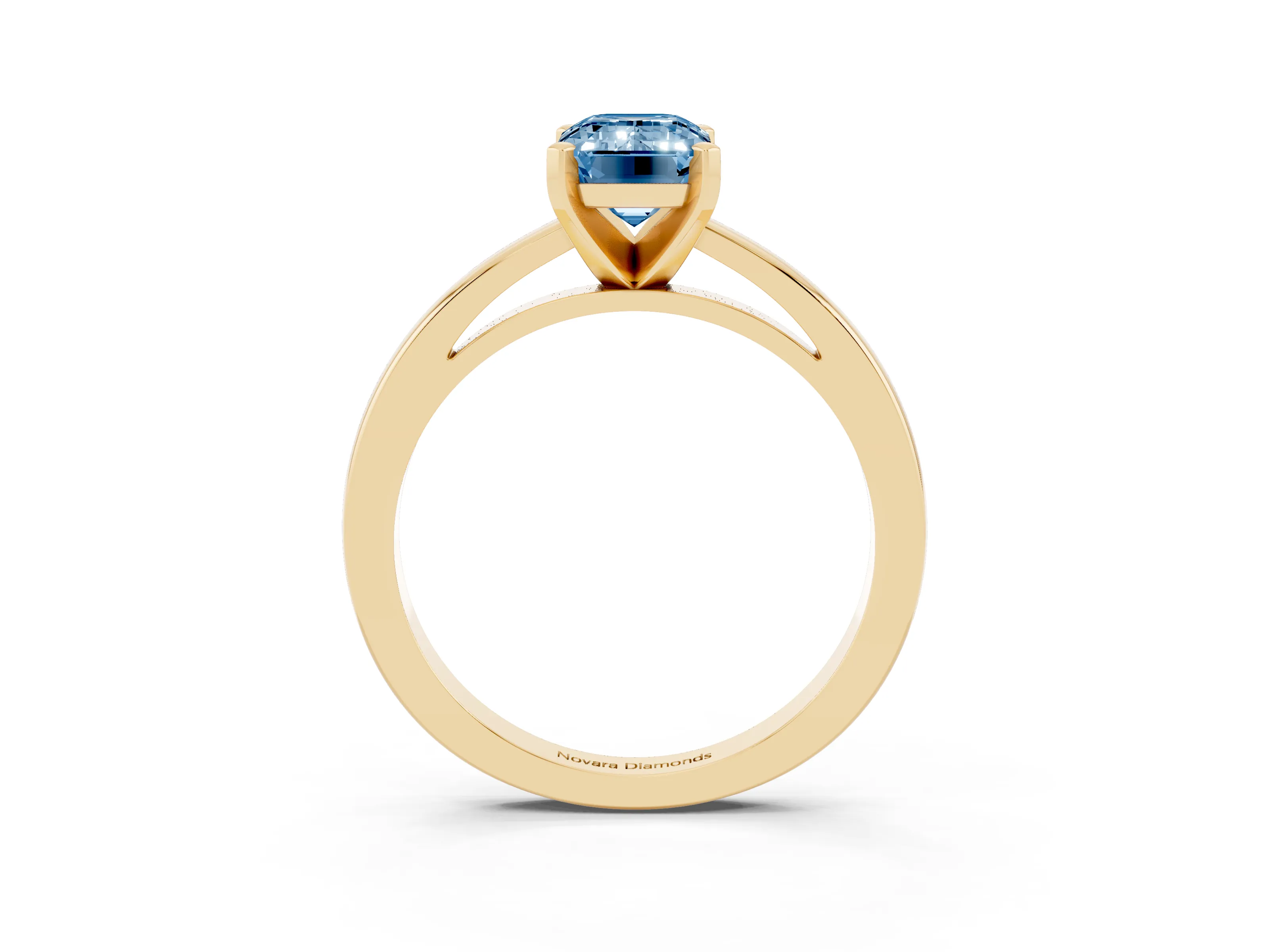 Fancy Blue Emerald Cut Diamond Solitaire Engagement Ring Set in Yellow gold with Prong Setting on a Classic Band