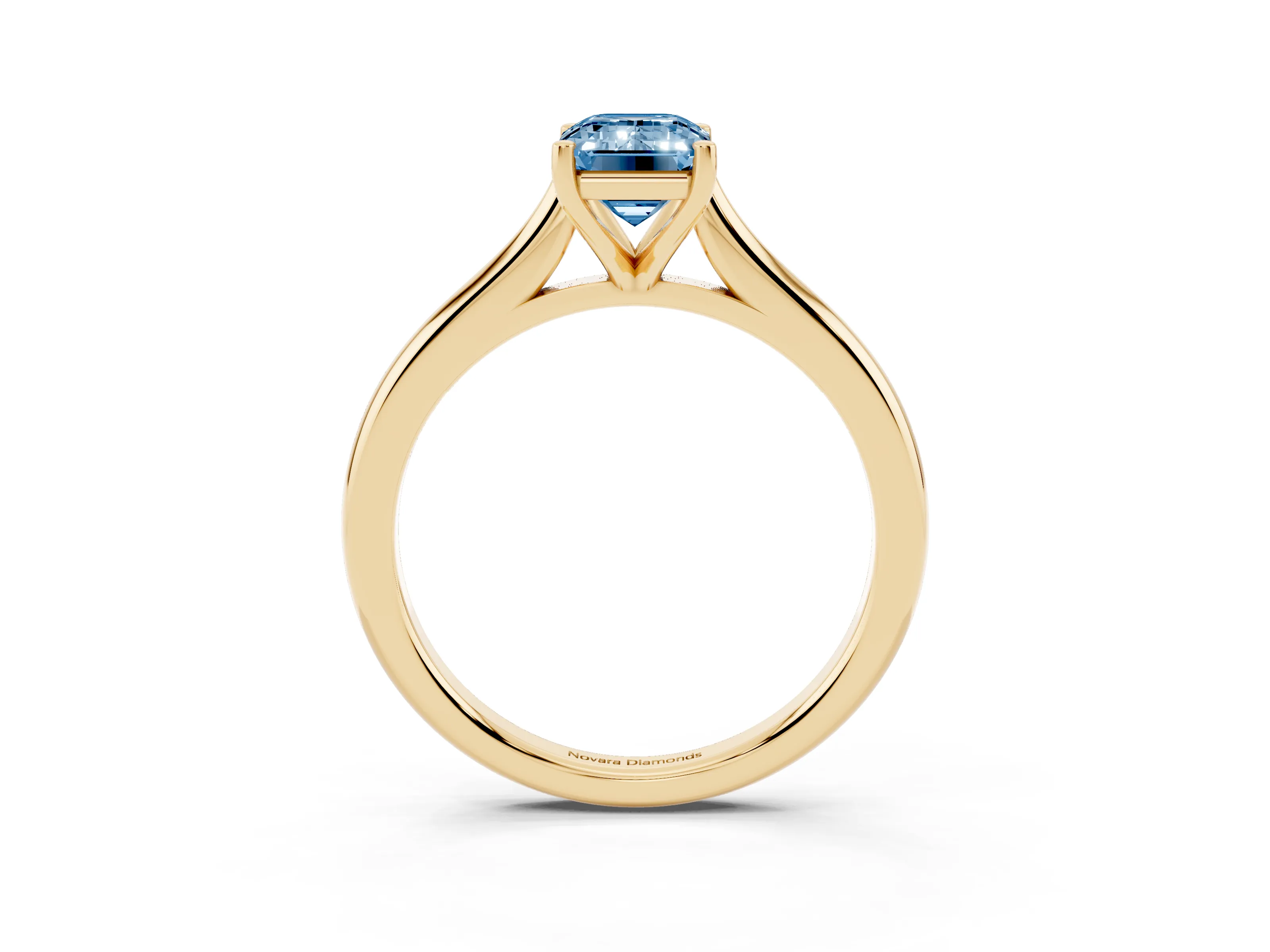 Fancy Blue Emerald Cut Diamond Solitaire Ring Set in Yellow gold with Cathedral Band and Prong Setting