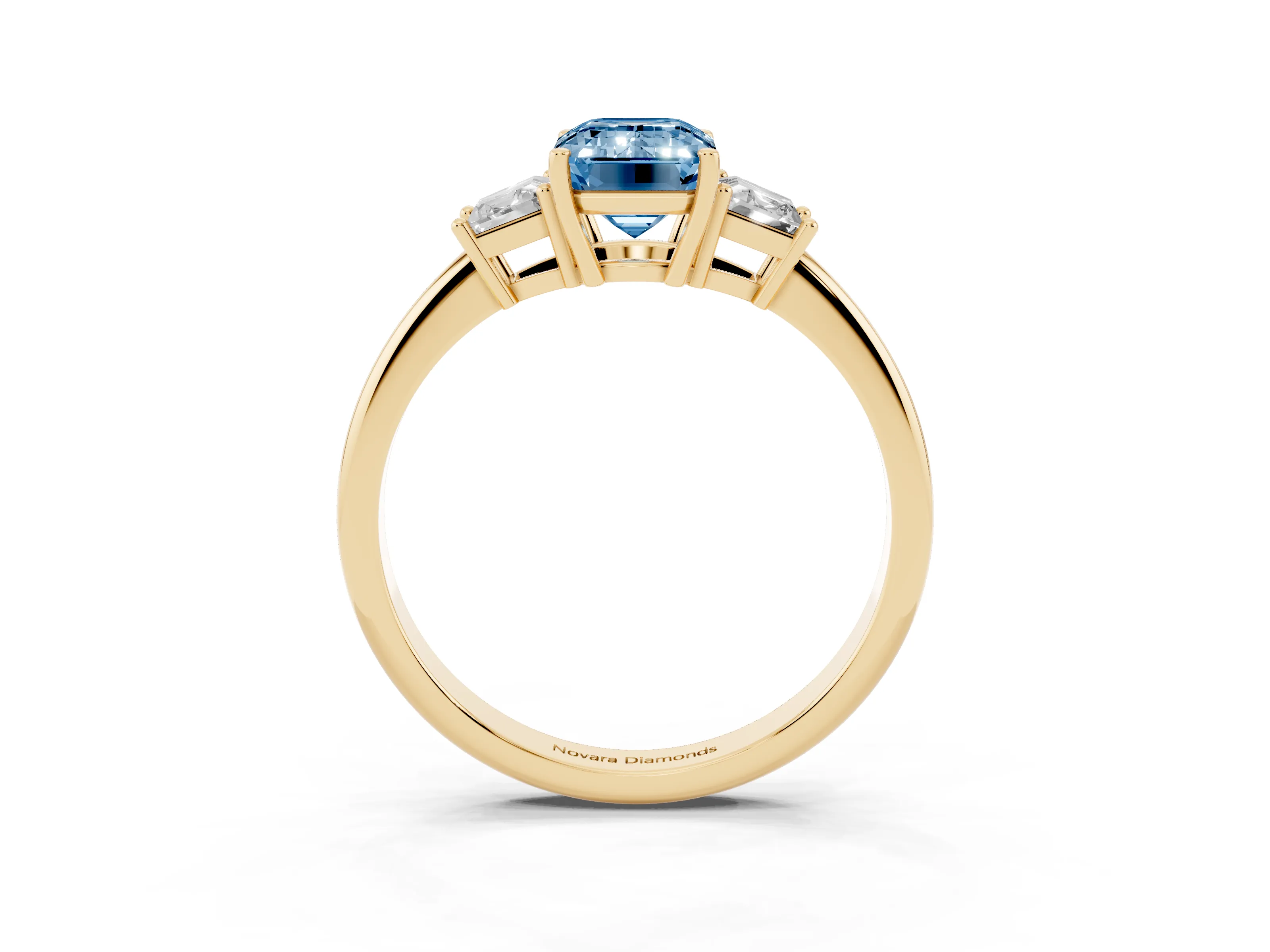 Fancy Blue Emerald Cut Diamond Three-Stone Ring Set in Yellow gold with Trapezoid Side Stones and Prong Setting