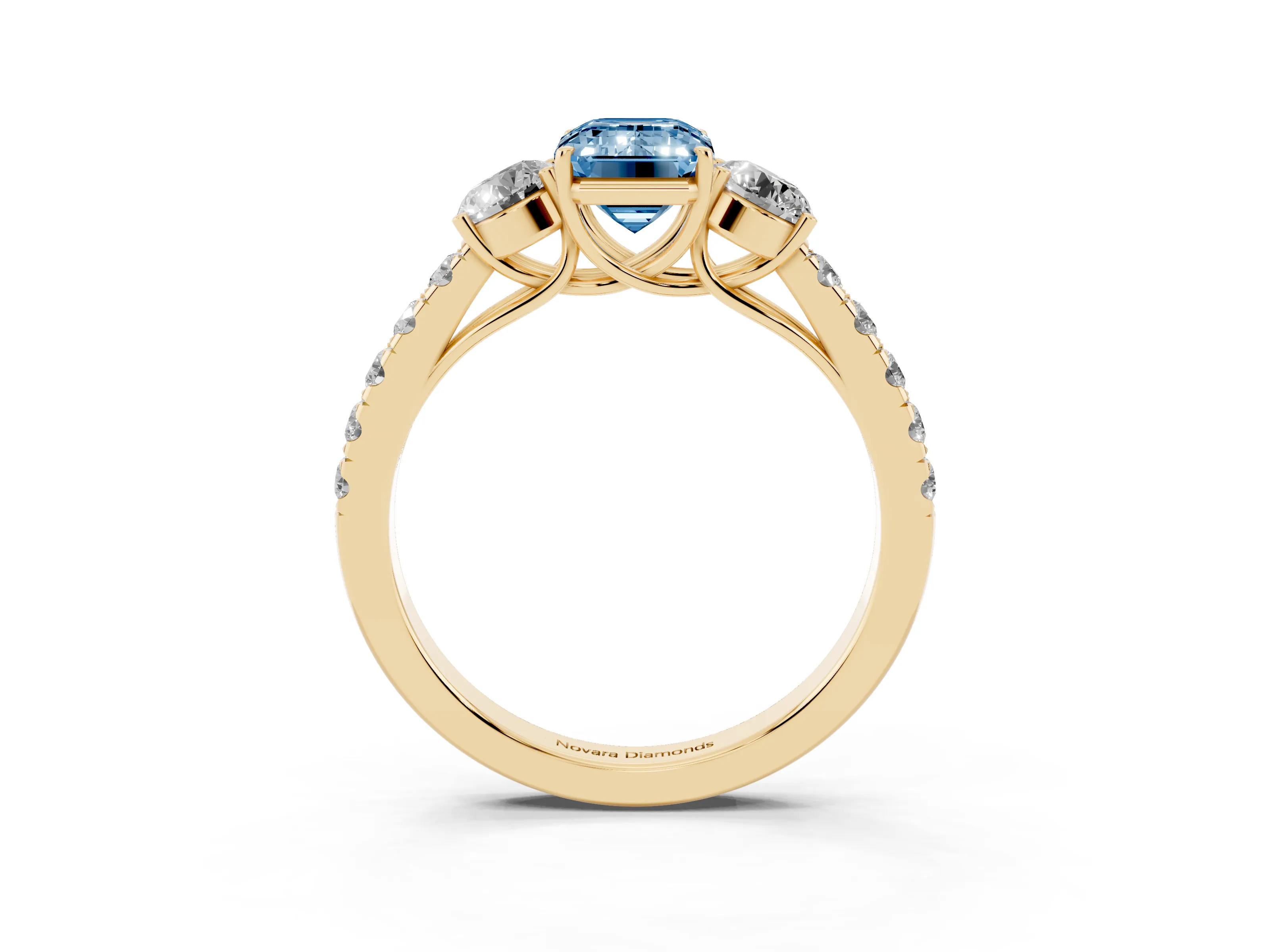 Fancy Blue Emerald Cut Diamond Three-Stone Ring Set in Yellow gold with Round Side Stones and Delicate Pavé Band