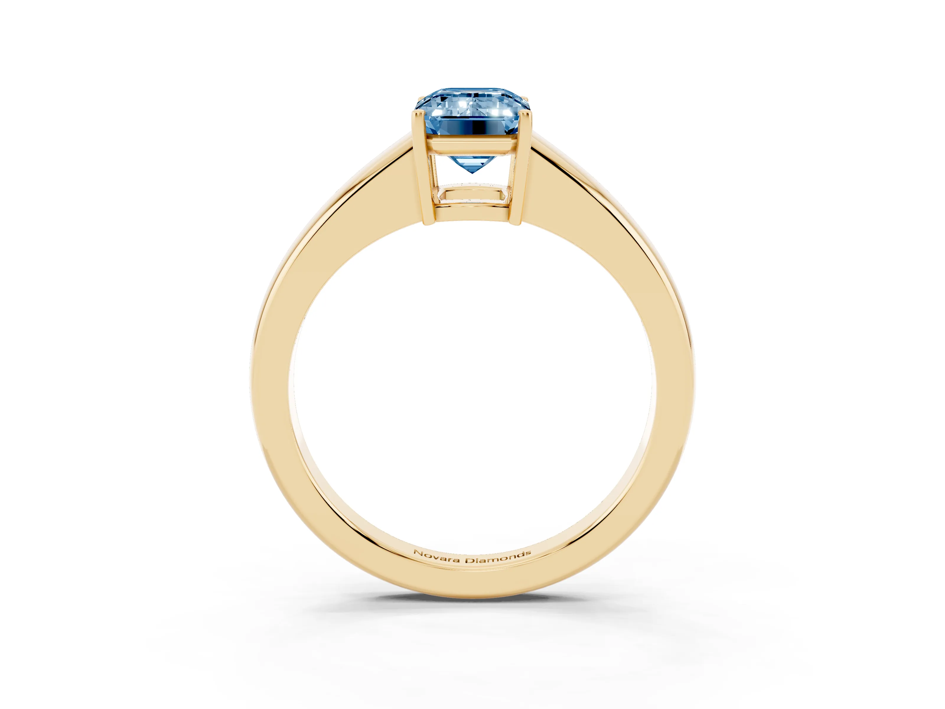 Fancy Blue Emerald Cut Diamond Solitaire Ring Set in Yellow gold with Tapered Band and Prong Setting