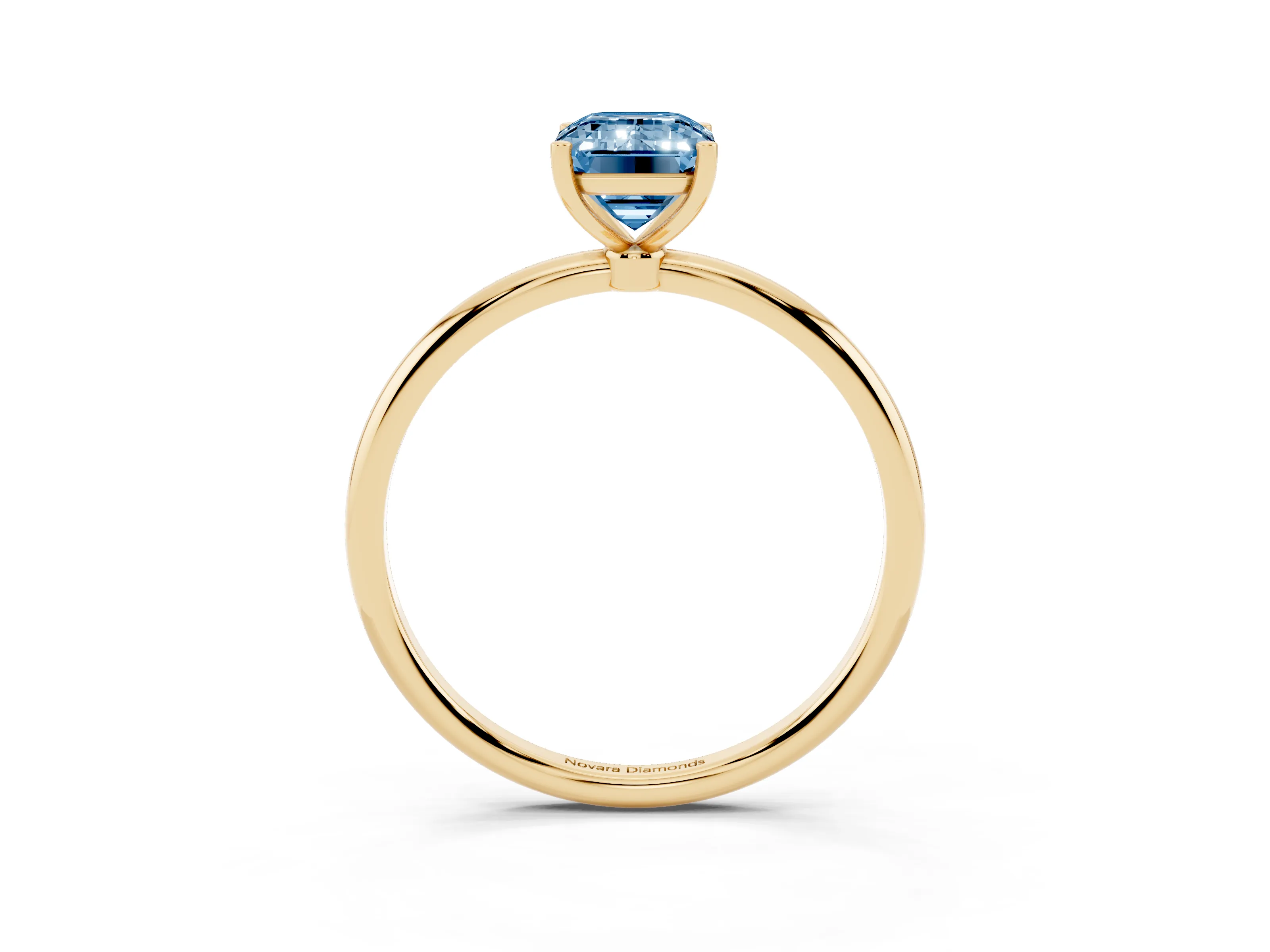 Fancy Blue Emerald Cut Diamond Solitaire Engagement Ring Set in Yellow gold with Thin Band and Prong Setting