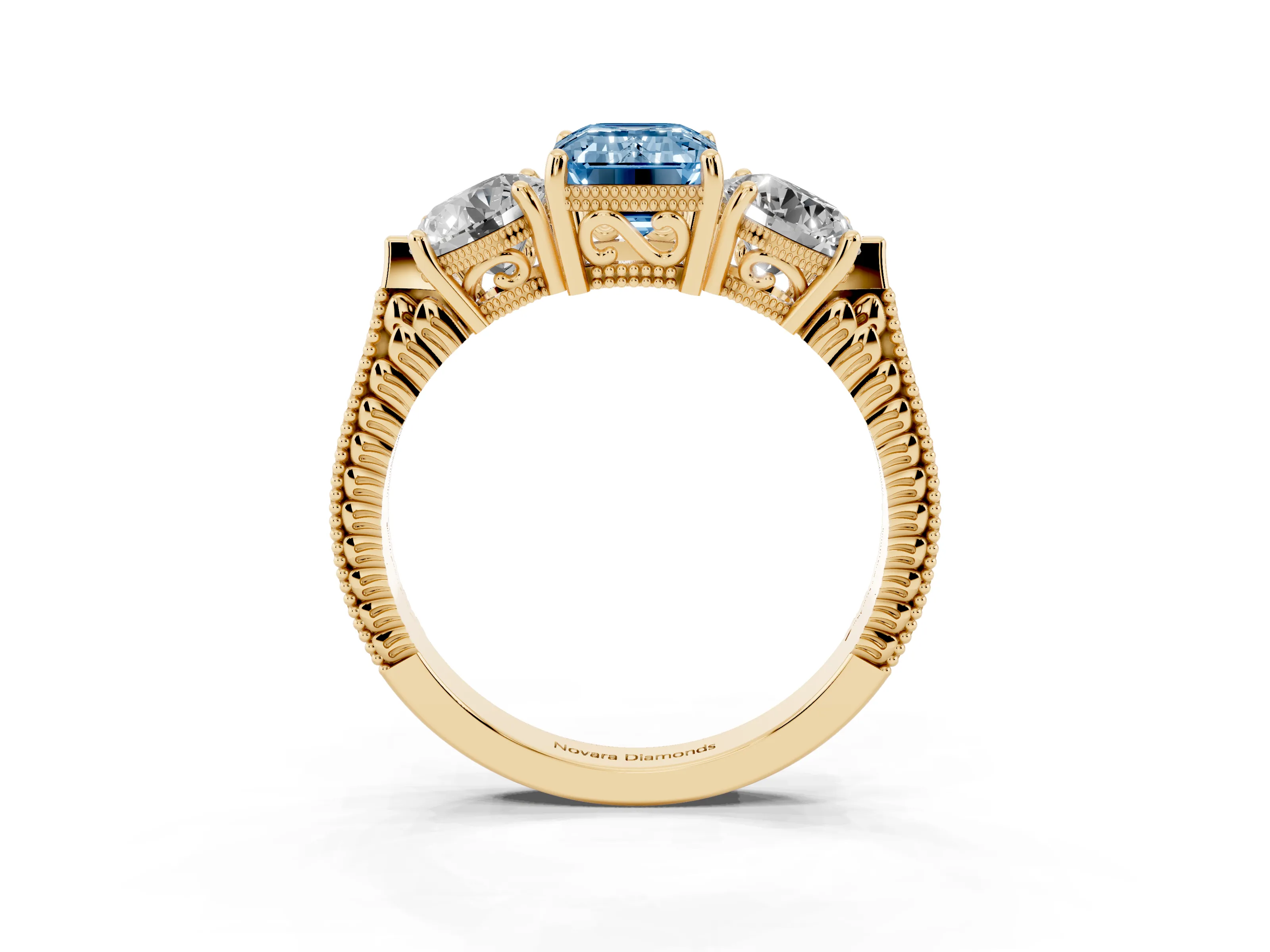 Fancy Blue Emerald Cut Diamond Three-Stone Ring Set in Yellow gold with Milgrain Band