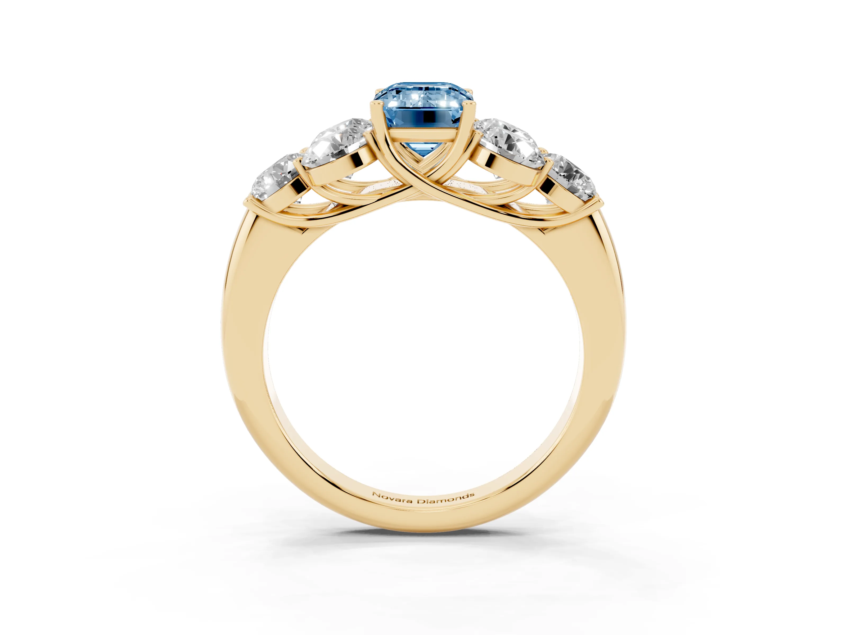 Fancy Blue Emerald Cut Diamond Cluster Ring Set in Yellow gold with Round Accent Stones and Prong Setting on a Plain Band