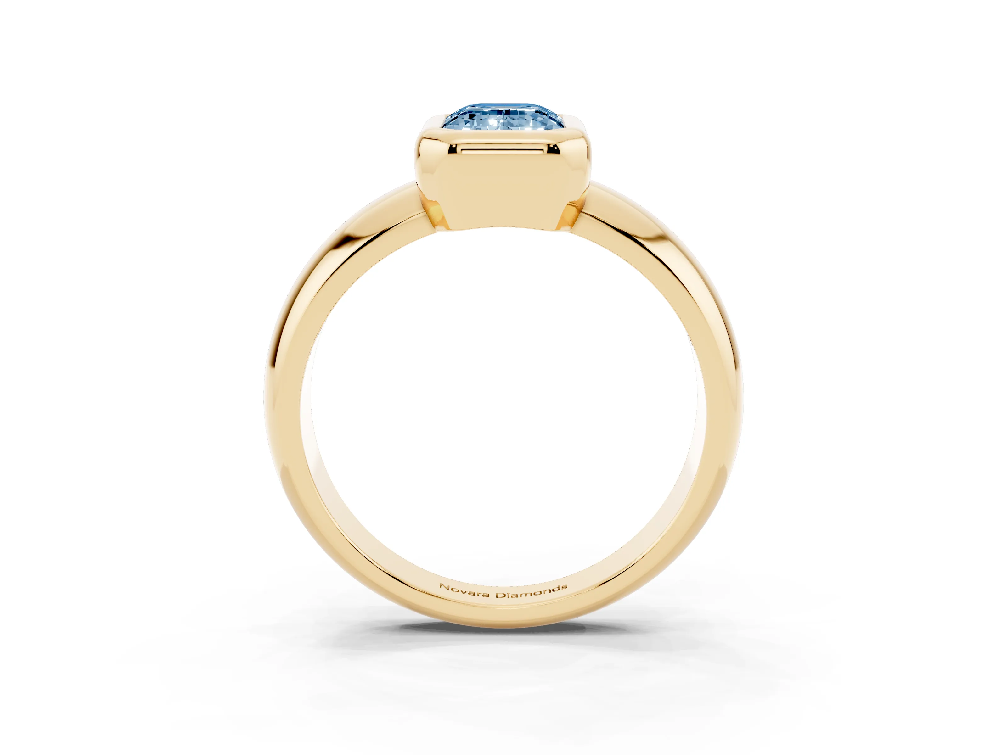Fancy Blue Bezel Set Emerald Cut Diamond Solitaire Ring Set in Yellow gold with Wide Band