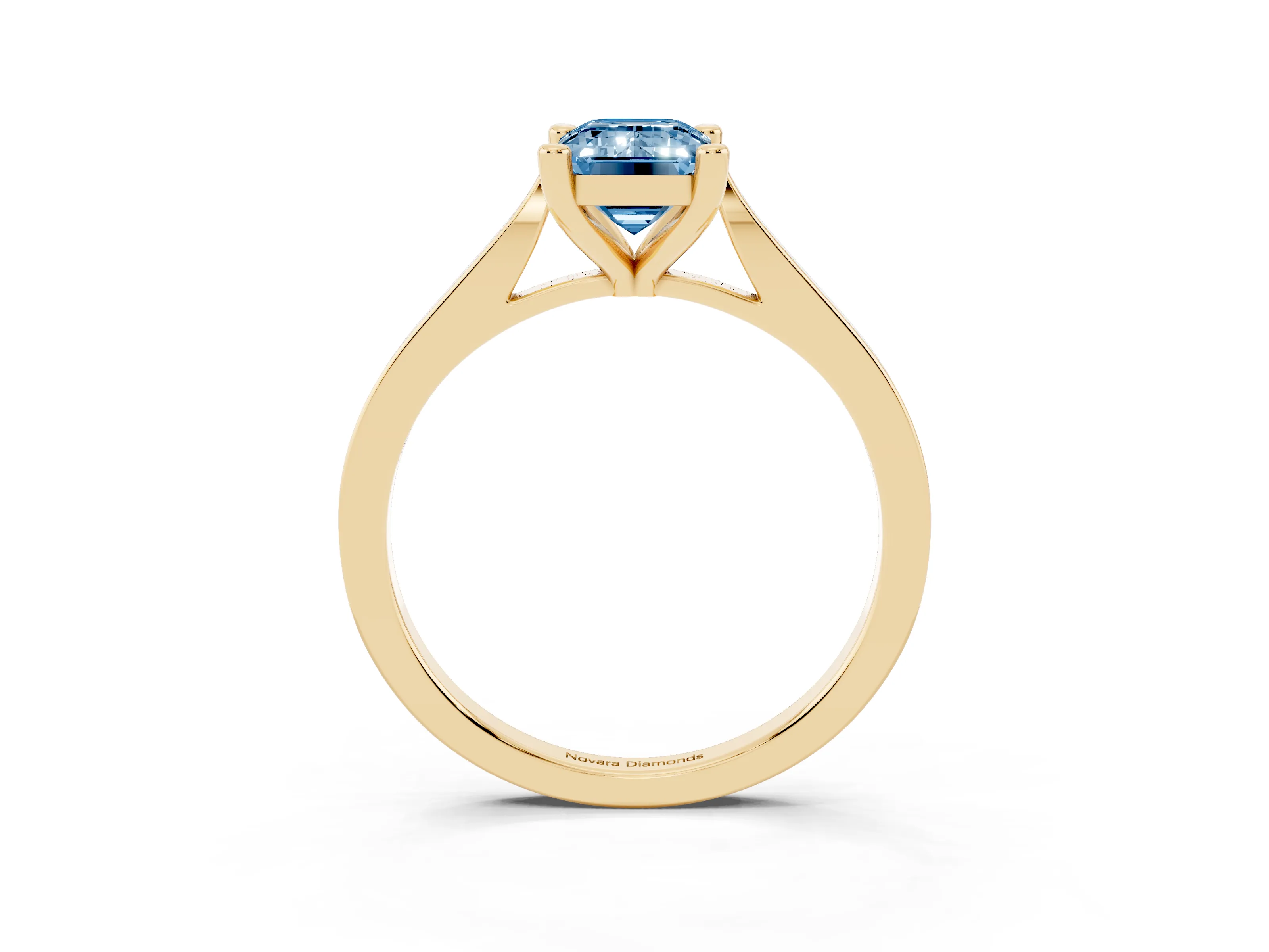 Fancy Blue Emerald Cut Diamond Solitaire Ring Set in Yellow gold with Prong Setting and Tapered Band