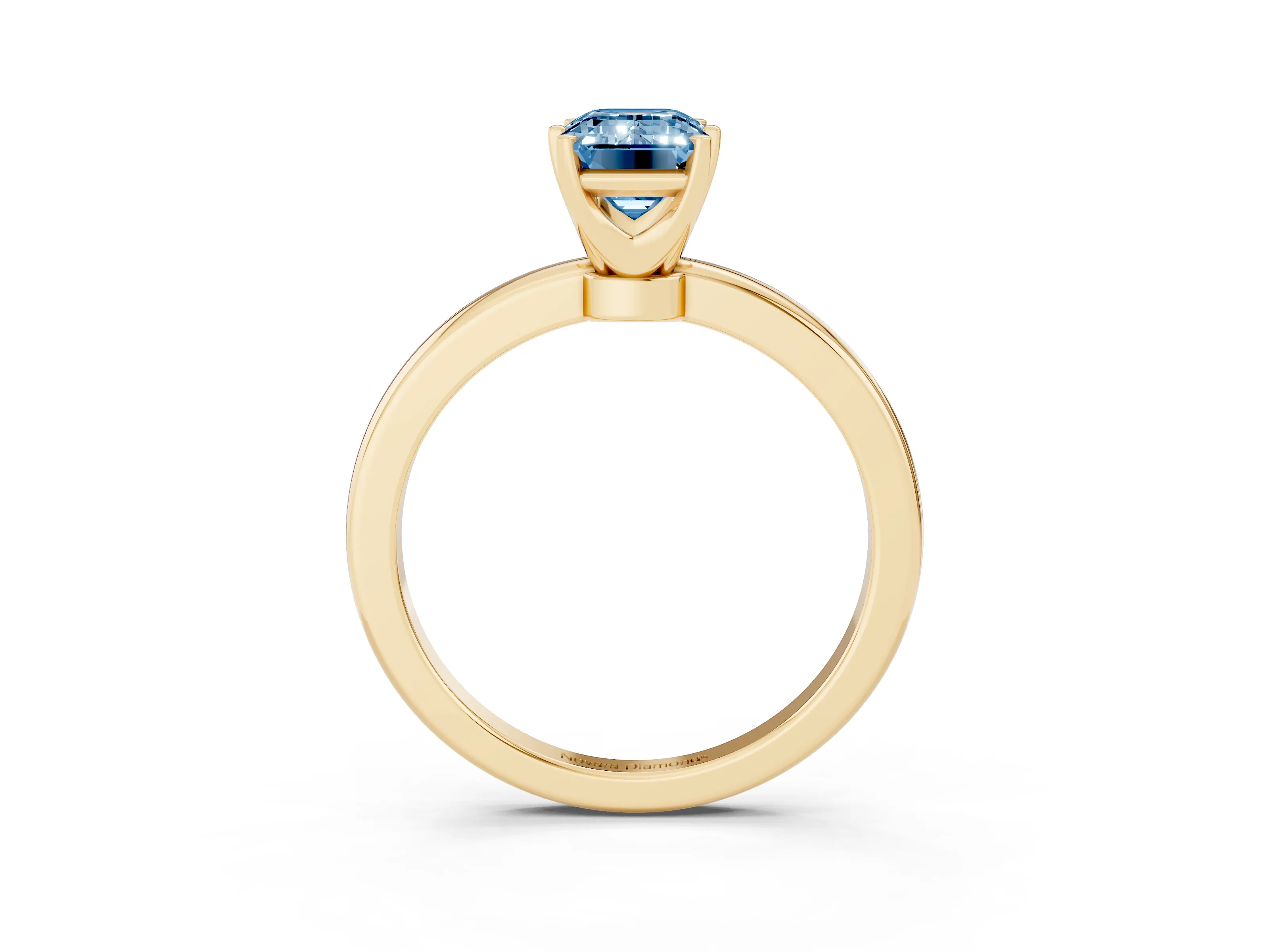 Fancy Blue Emerald Cut Diamond Solitaire Ring Set in Yellow gold with Raised Prong Setting on a Classic Band