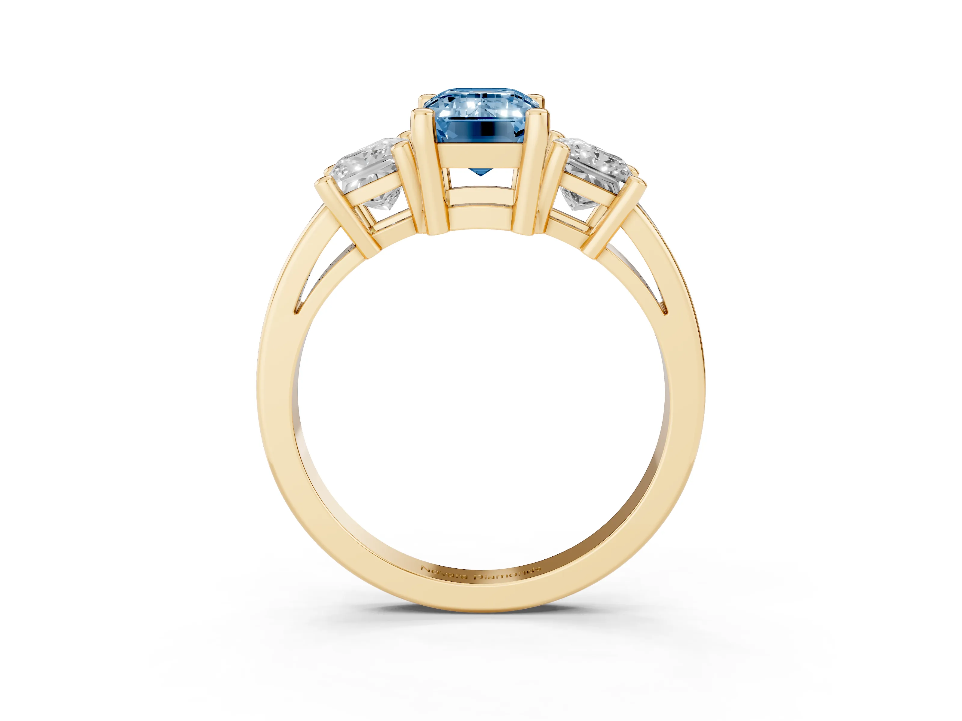 Fancy Blue Three-Stone Emerald Cut Diamond Solitaire Ring Set in Yellow gold with Prong Setting
