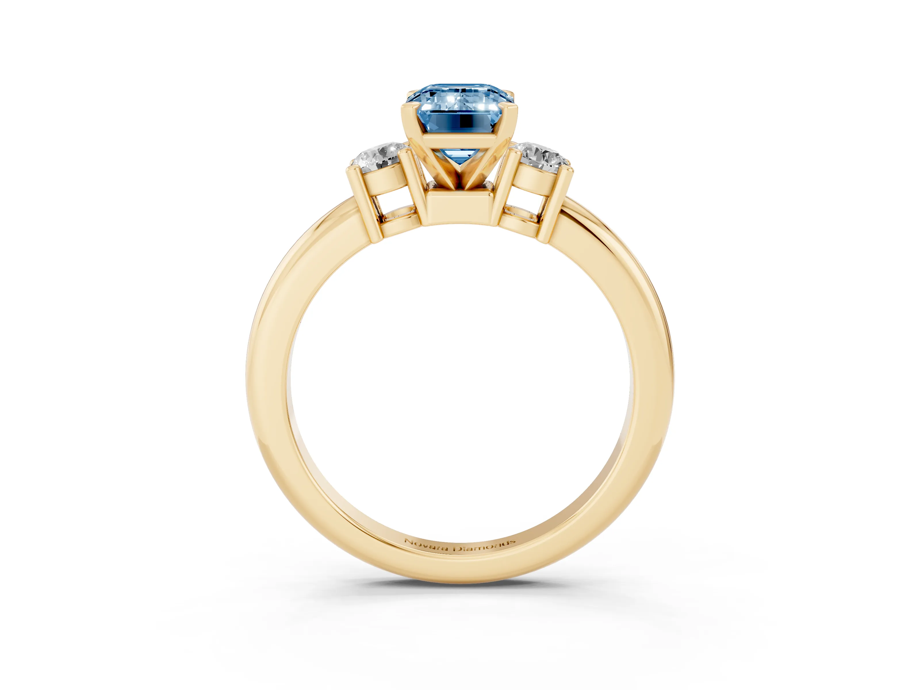 Fancy Blue Three-Stone Emerald Cut Diamond Ring Set in Yellow gold with Prong Setting and Plain Band