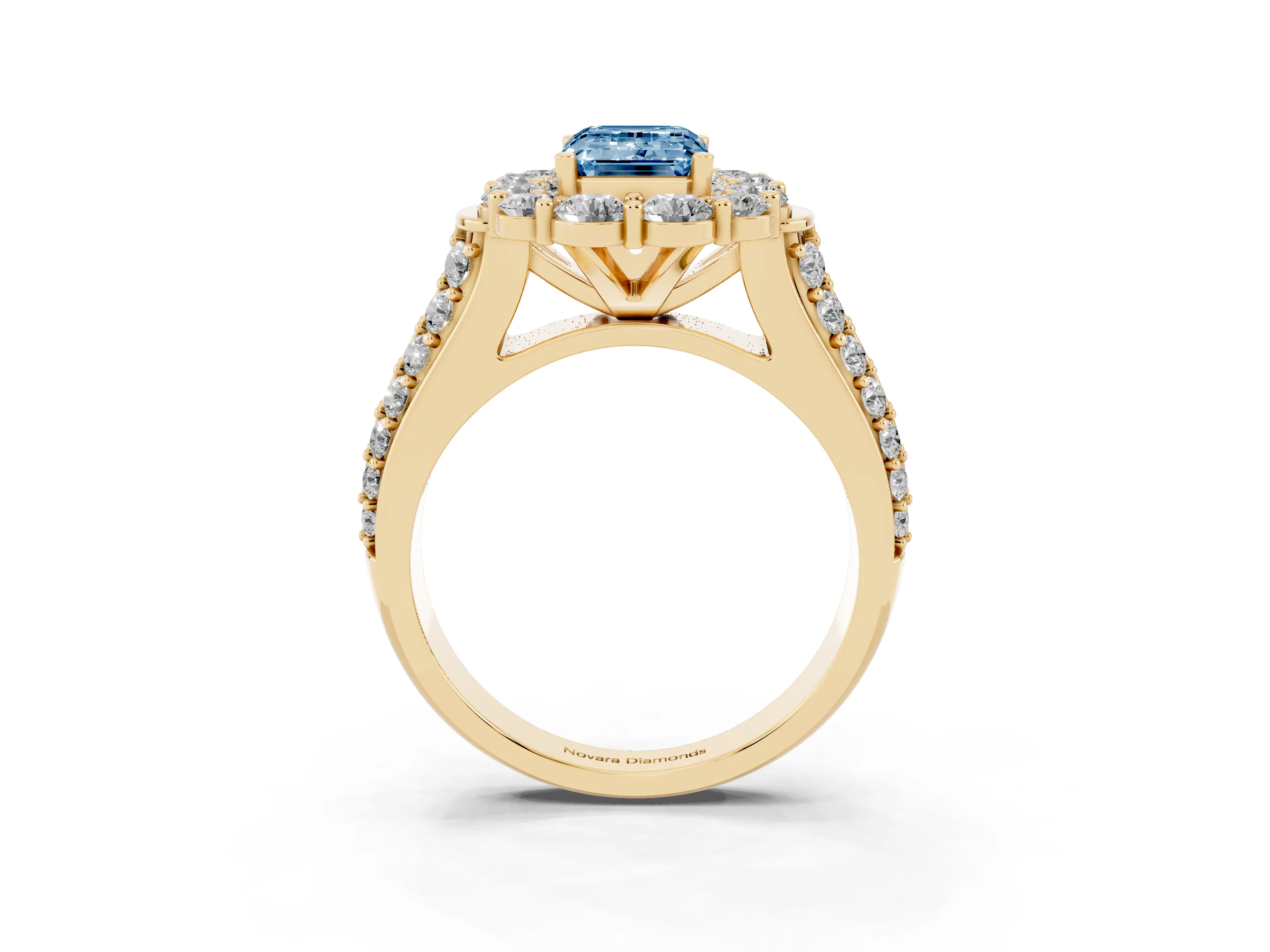 Fancy Blue Emerald Cut Diamond Halo Engagement Ring Set in Yellow gold with Split Shank and Prong Setting