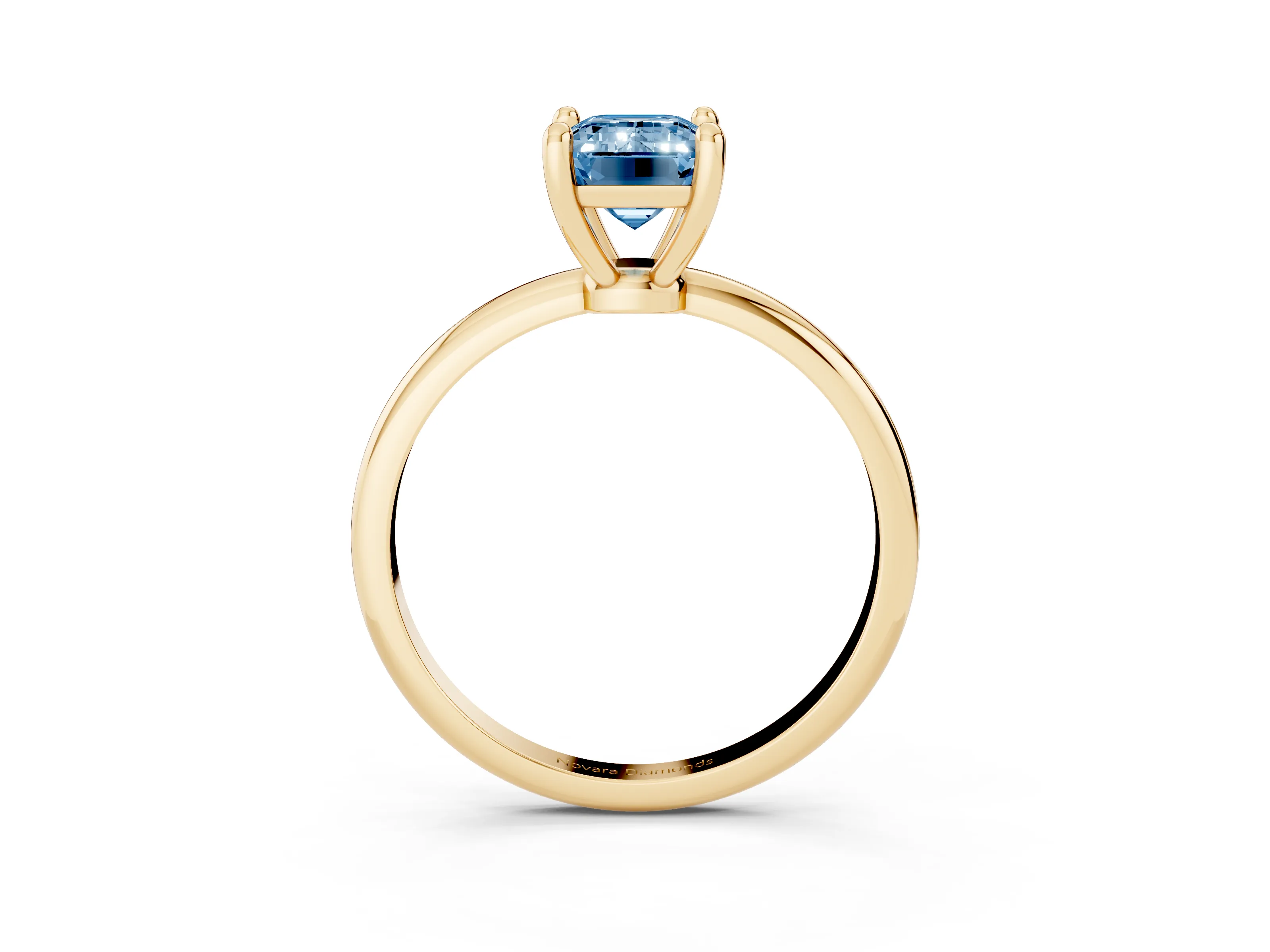 Fancy Blue Emerald Cut Diamond Solitaire Ring Set in Yellow gold with Secure Prong Setting on a Classic Band