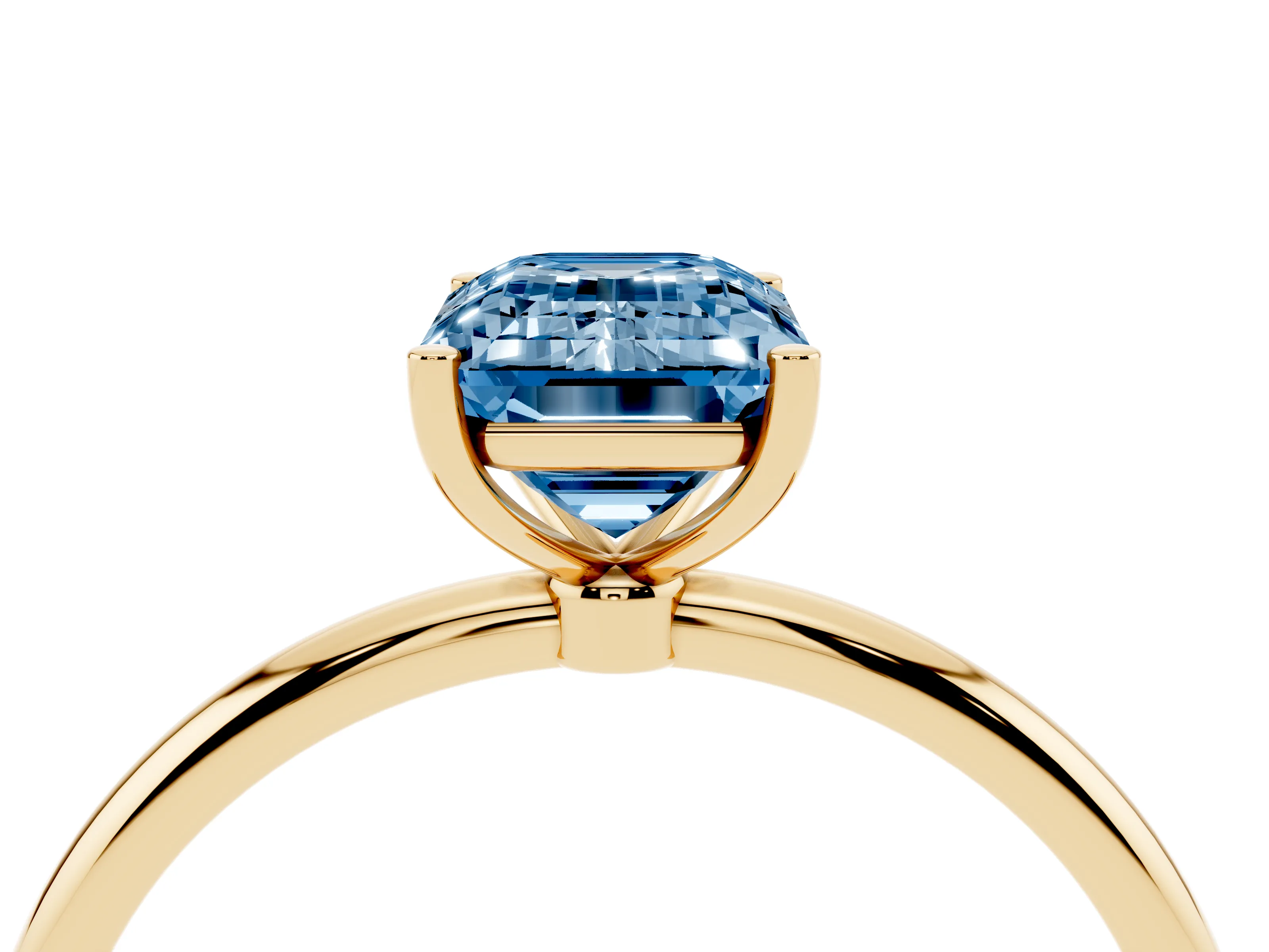 Fancy Blue Emerald Cut Diamond Solitaire Engagement Ring Set in Yellow gold with Thin Band and Prong Setting
