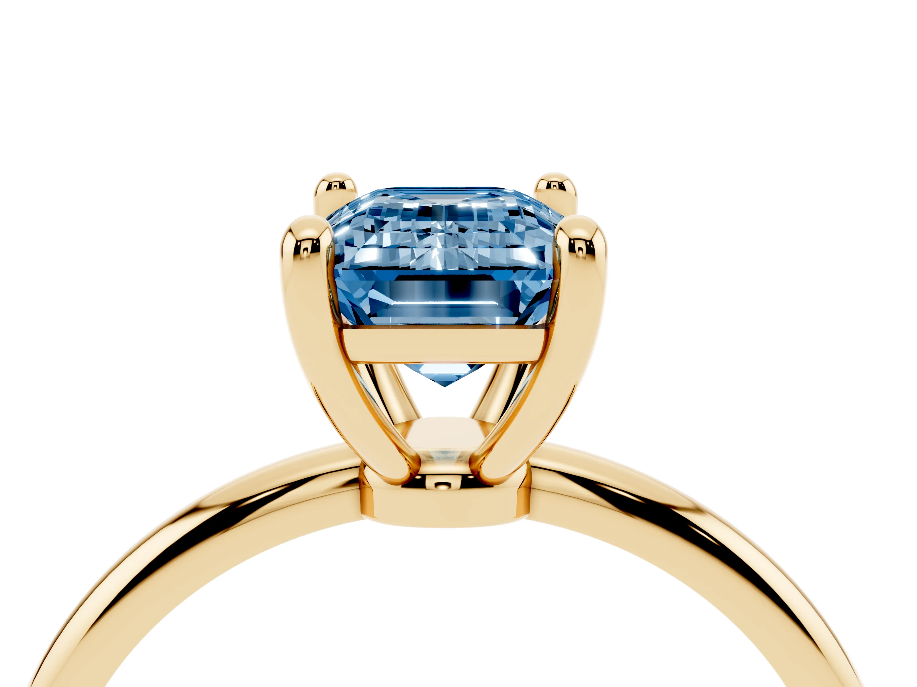 Fancy Blue Emerald Cut Diamond Solitaire Ring Set in Yellow gold with Secure Prong Setting on a Classic Band