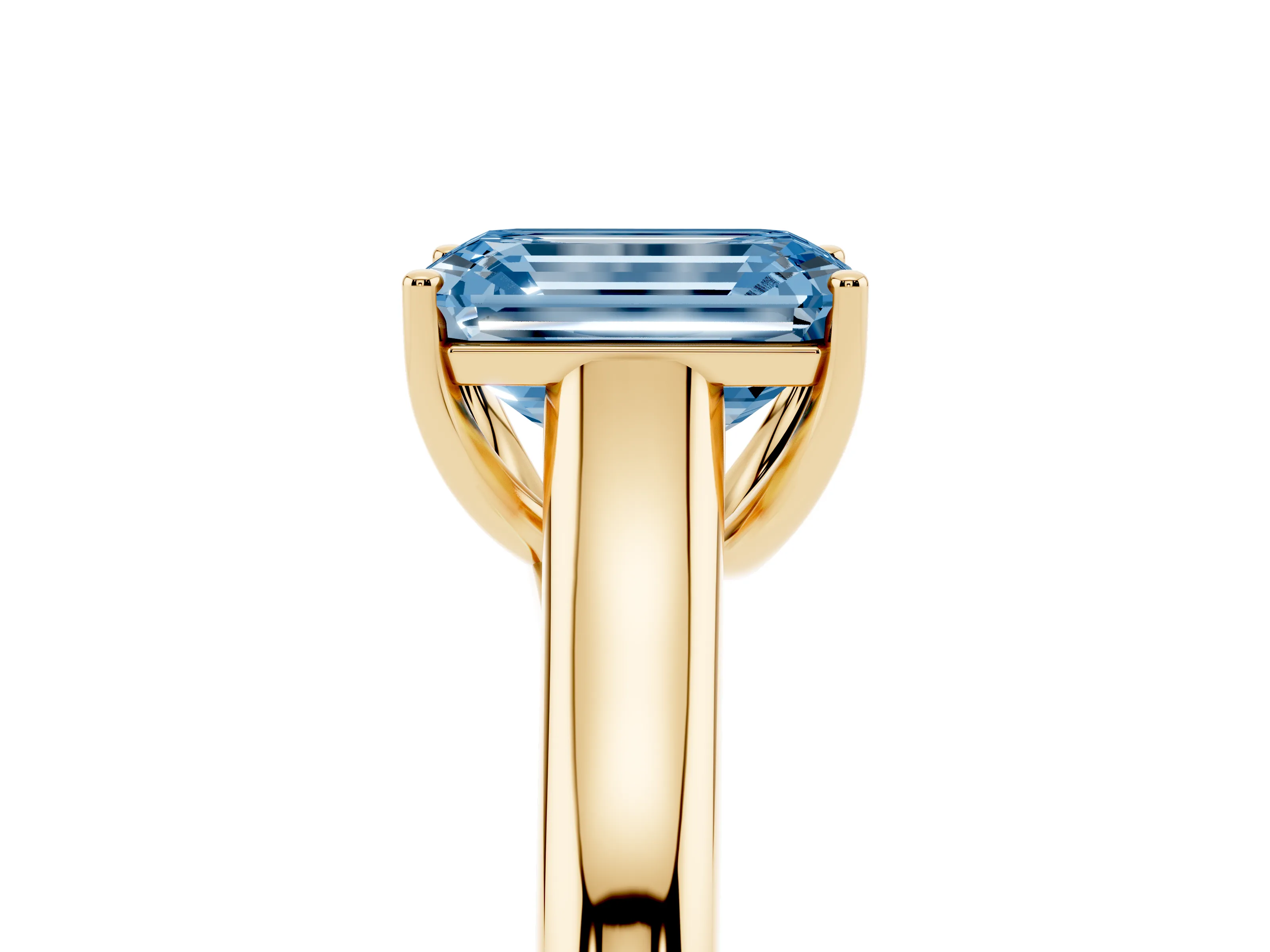 Fancy Blue Emerald Cut Diamond Solitaire Engagement Ring Set in Yellow gold with Subtly Tapered Band and Prong Setting