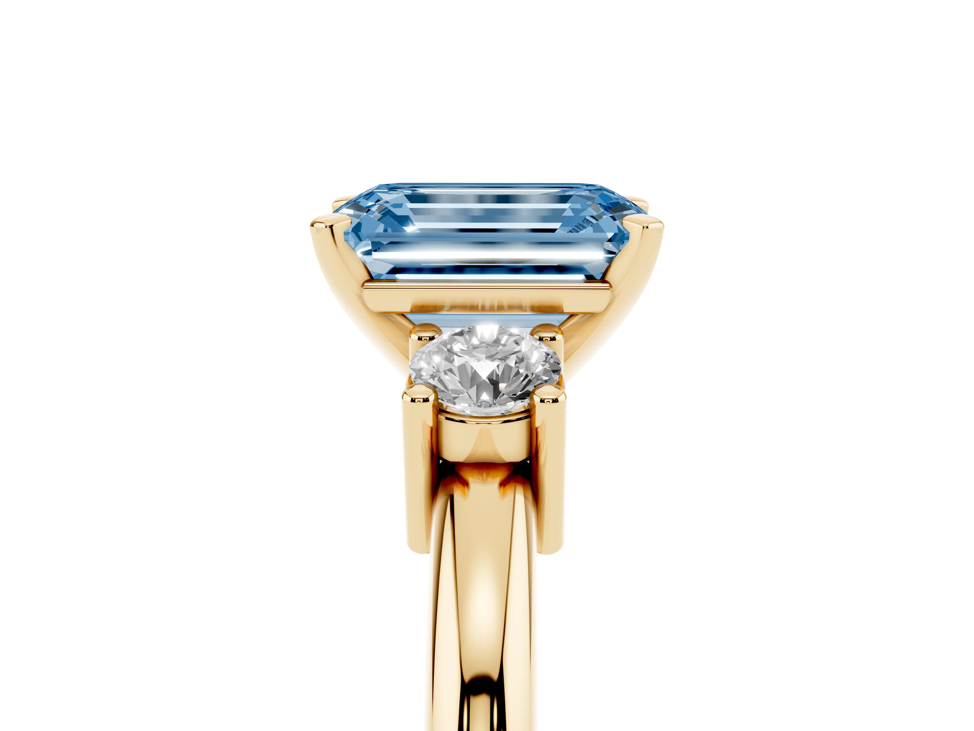 Fancy Blue Three-Stone Emerald Cut Diamond Ring Set in Yellow gold with Prong Setting and Plain Band